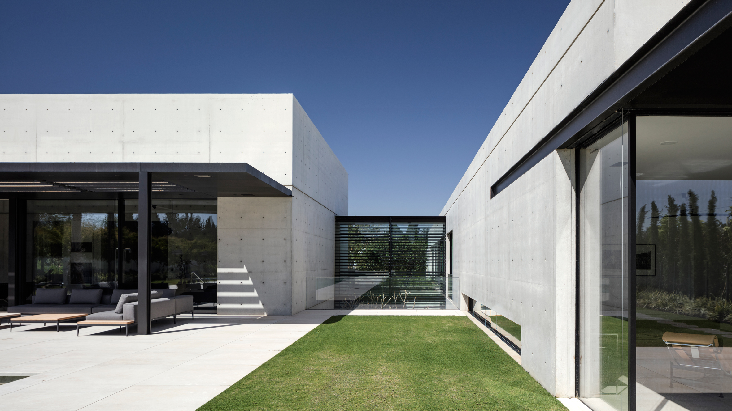 Concrete and glass surfaces extend from inside to outside of Israeli ...