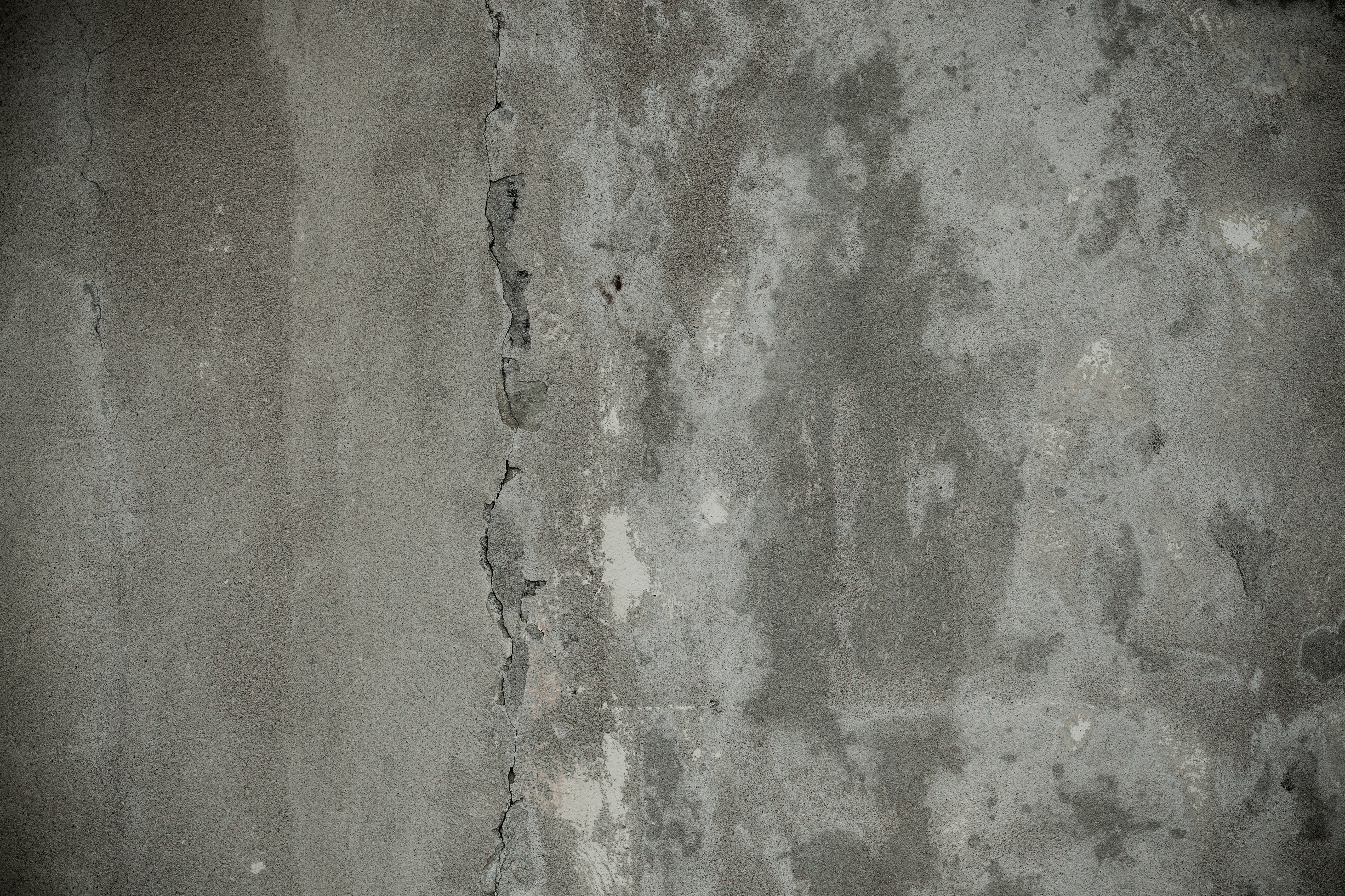 Gray cracked concrete surface photo