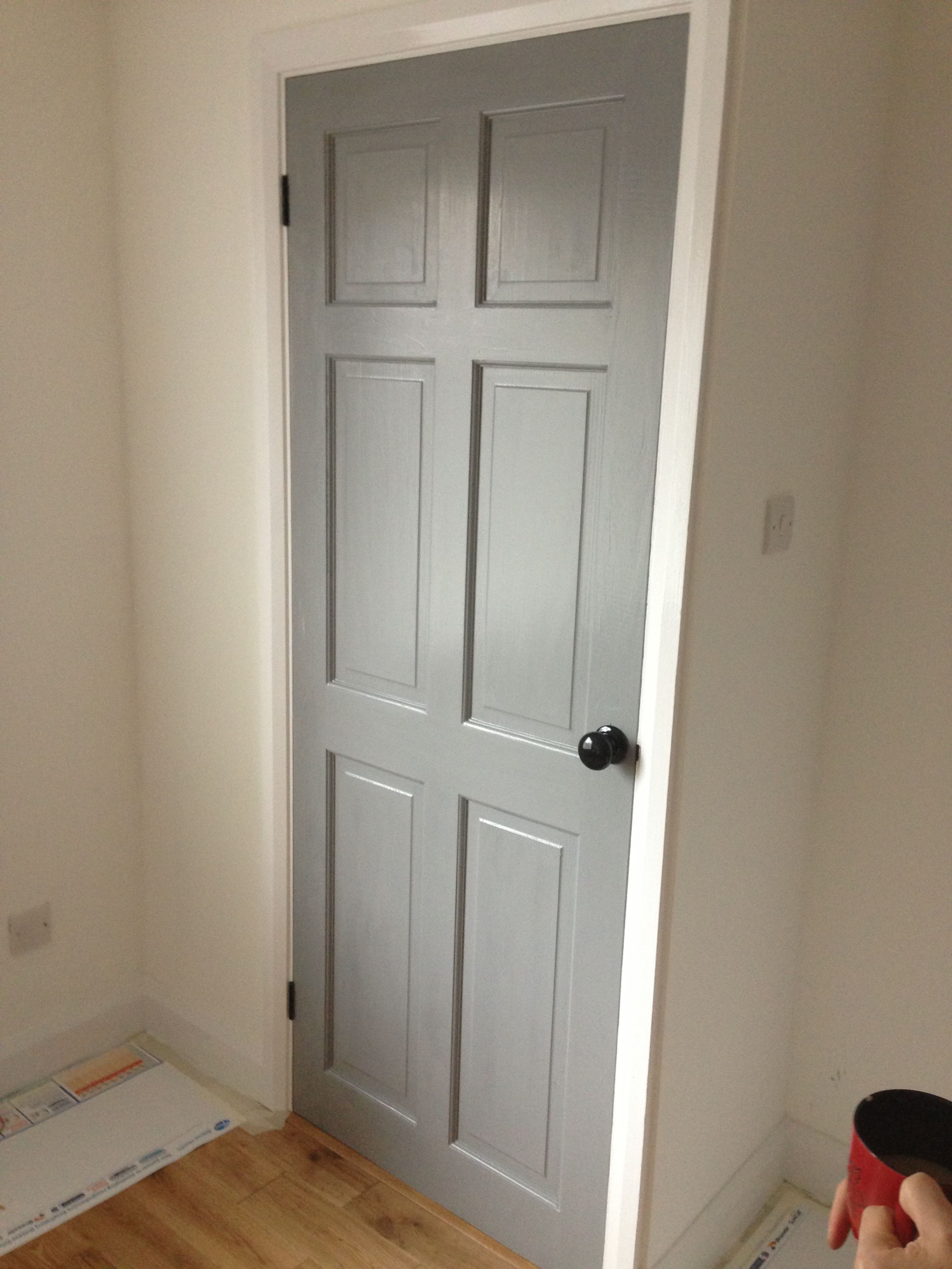 Grey door, black knob, black hinges, white surround. | Home ...