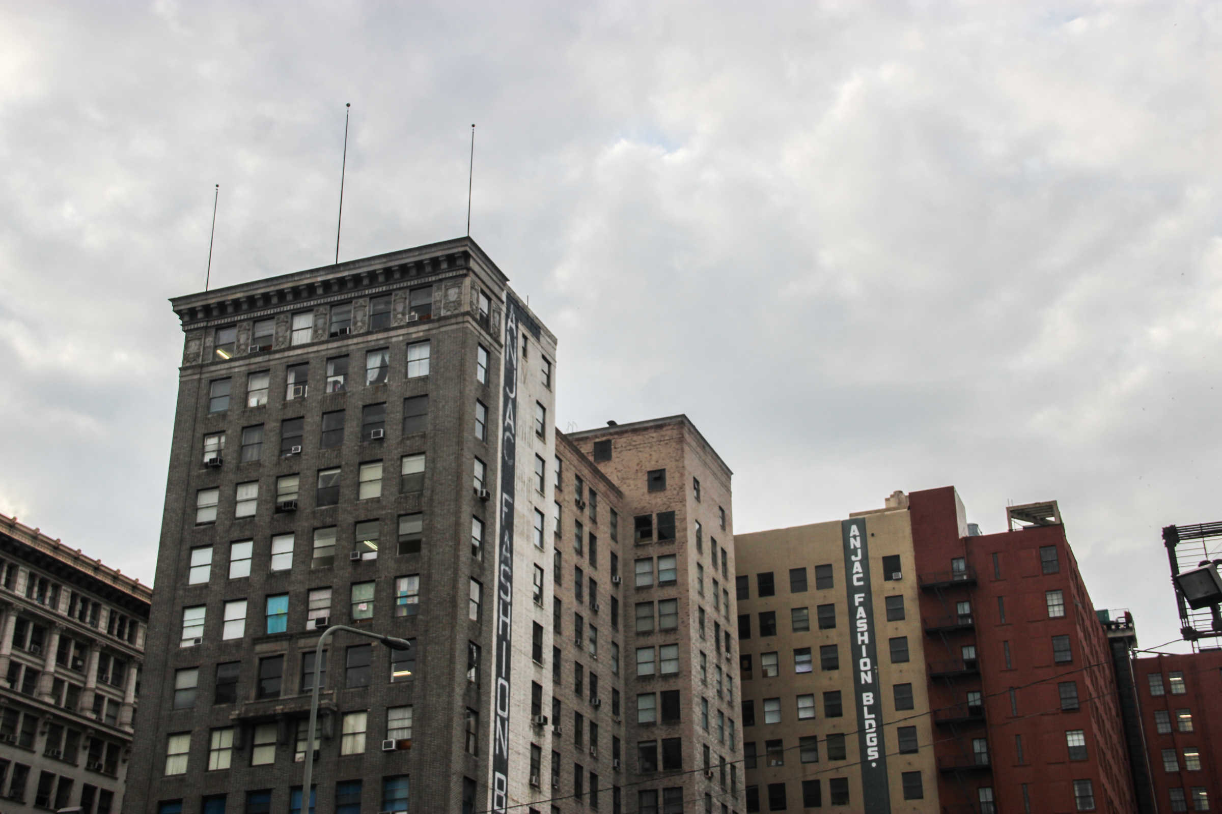 Free Stock Photo of Old High Rise Buildings Under Overcast Sky