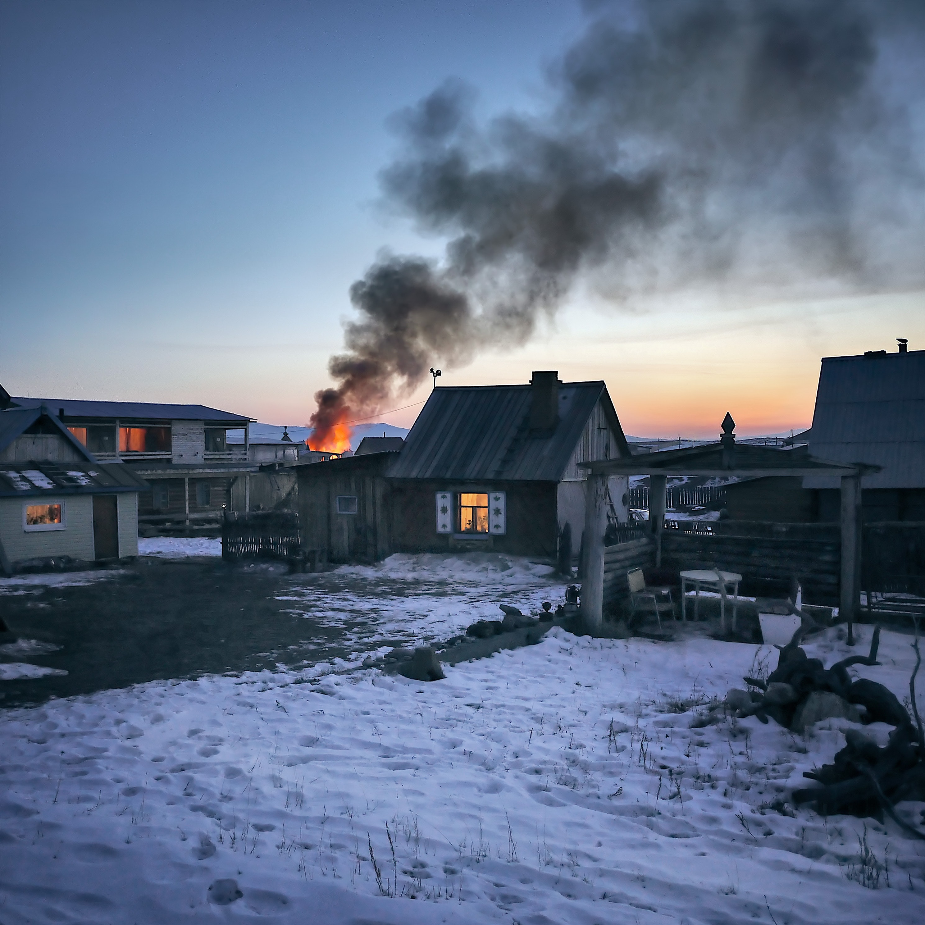 Gray wooden house burning photo
