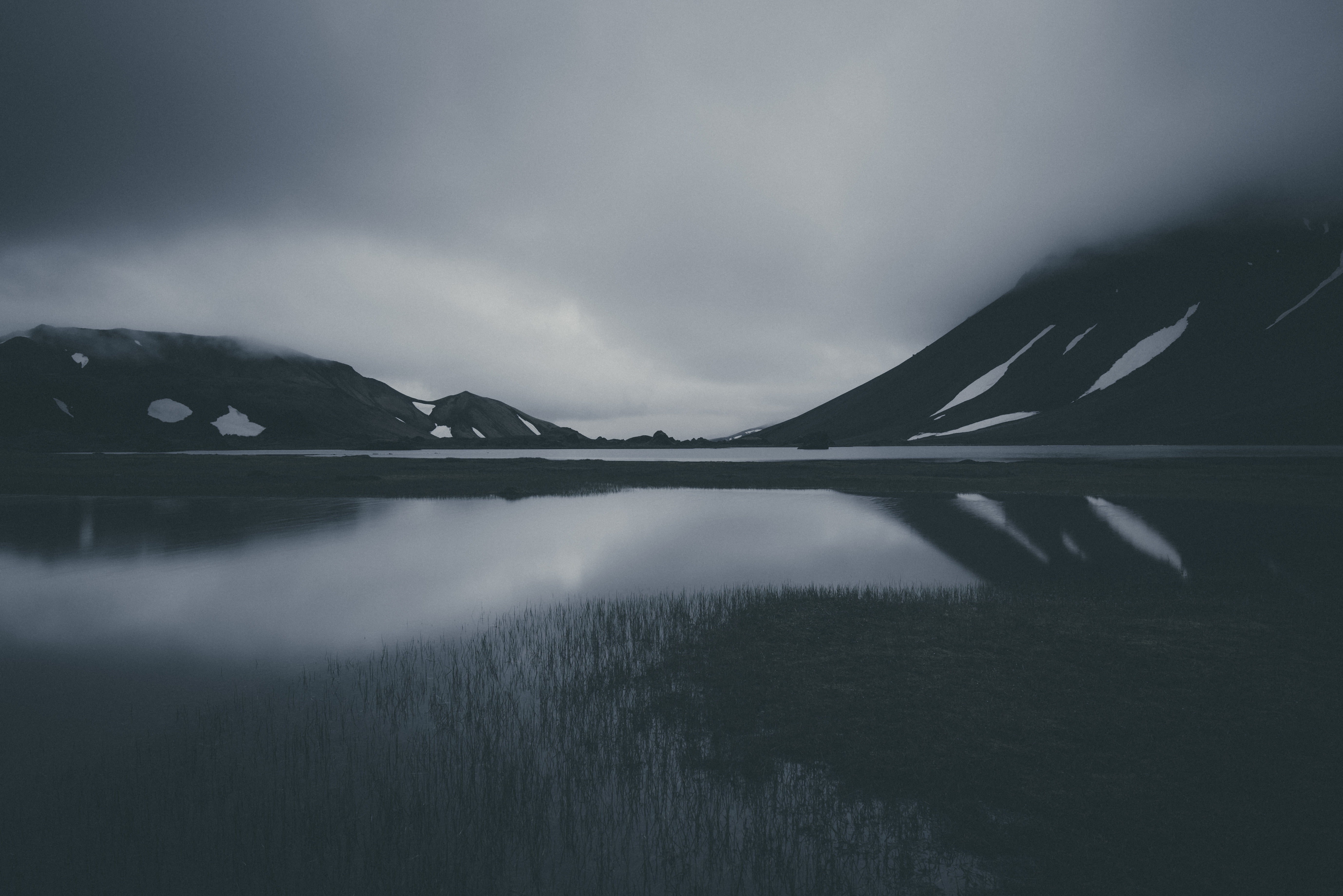 Grayscale photo of body of water near mountain HD wallpaper ...