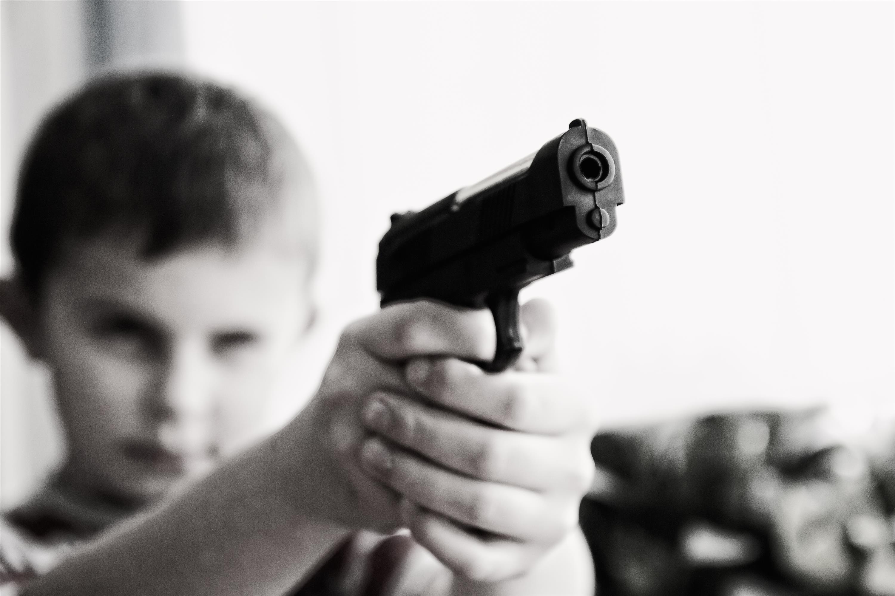 Grayscale Photo of a Boy Aiming Toy Gun Selective Focus Photography, Blur, Child, Gun, Handgun, HQ Photo
