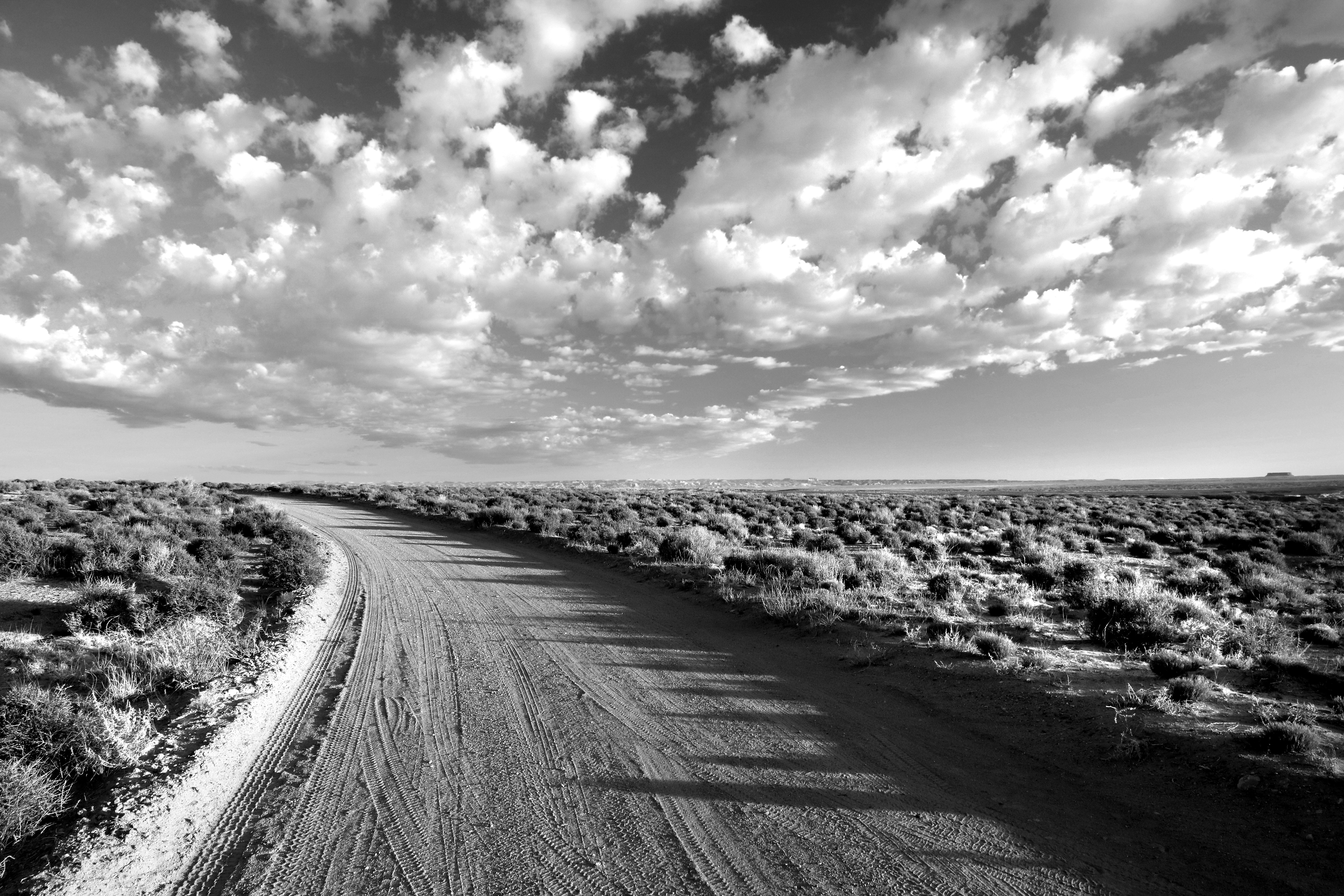 Grayscale Photo of Empty Road Between Grass Field Under Cloudy Sky, Arid, Barren, Black-and-white, Clouds, HQ Photo
