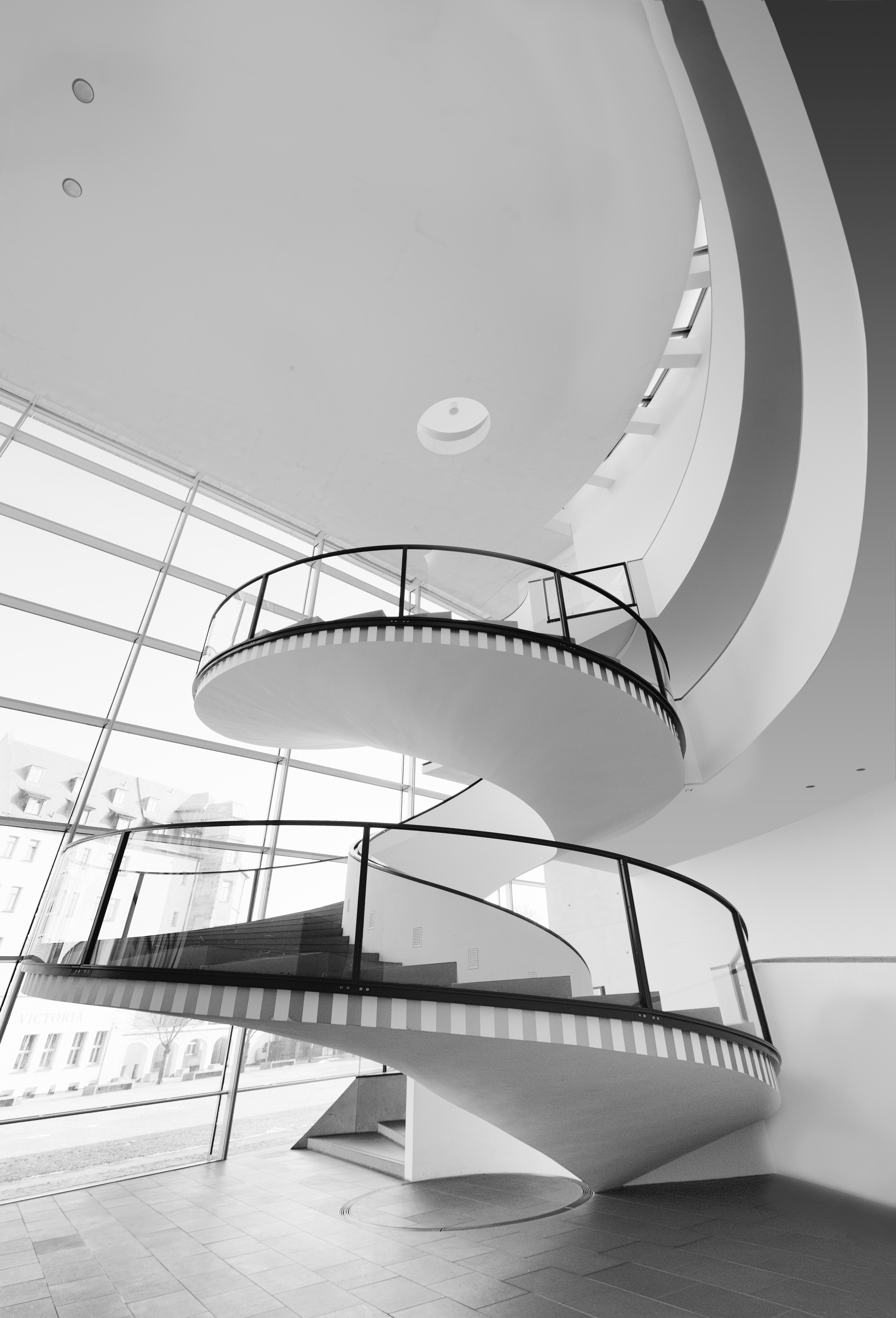 Grayscale photo of spiral stairs