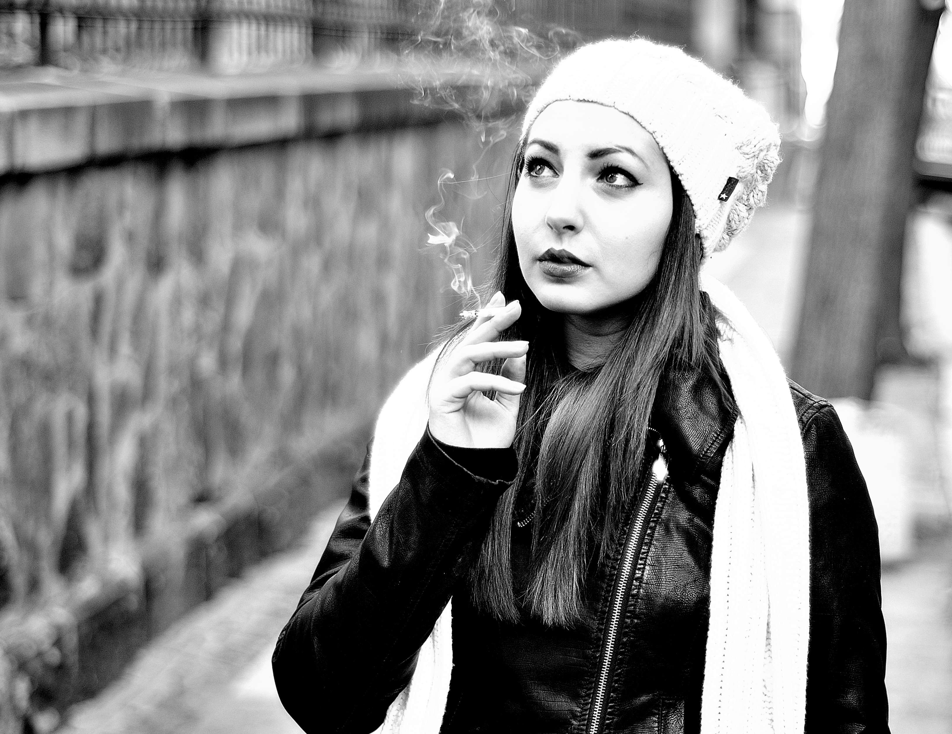 Grayscale photography of woman smoking