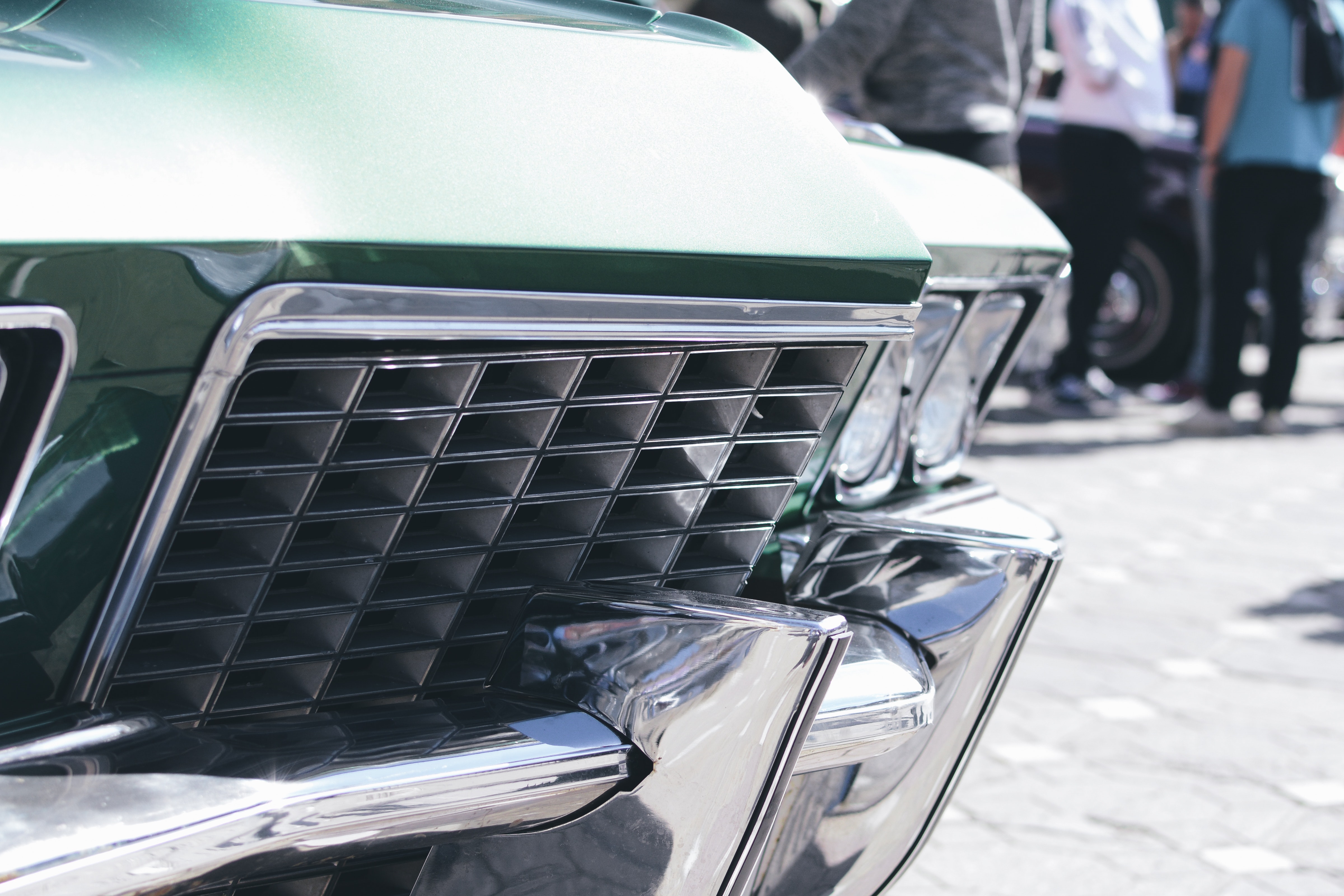 Green and silver car grille in tilt shift lens photo
