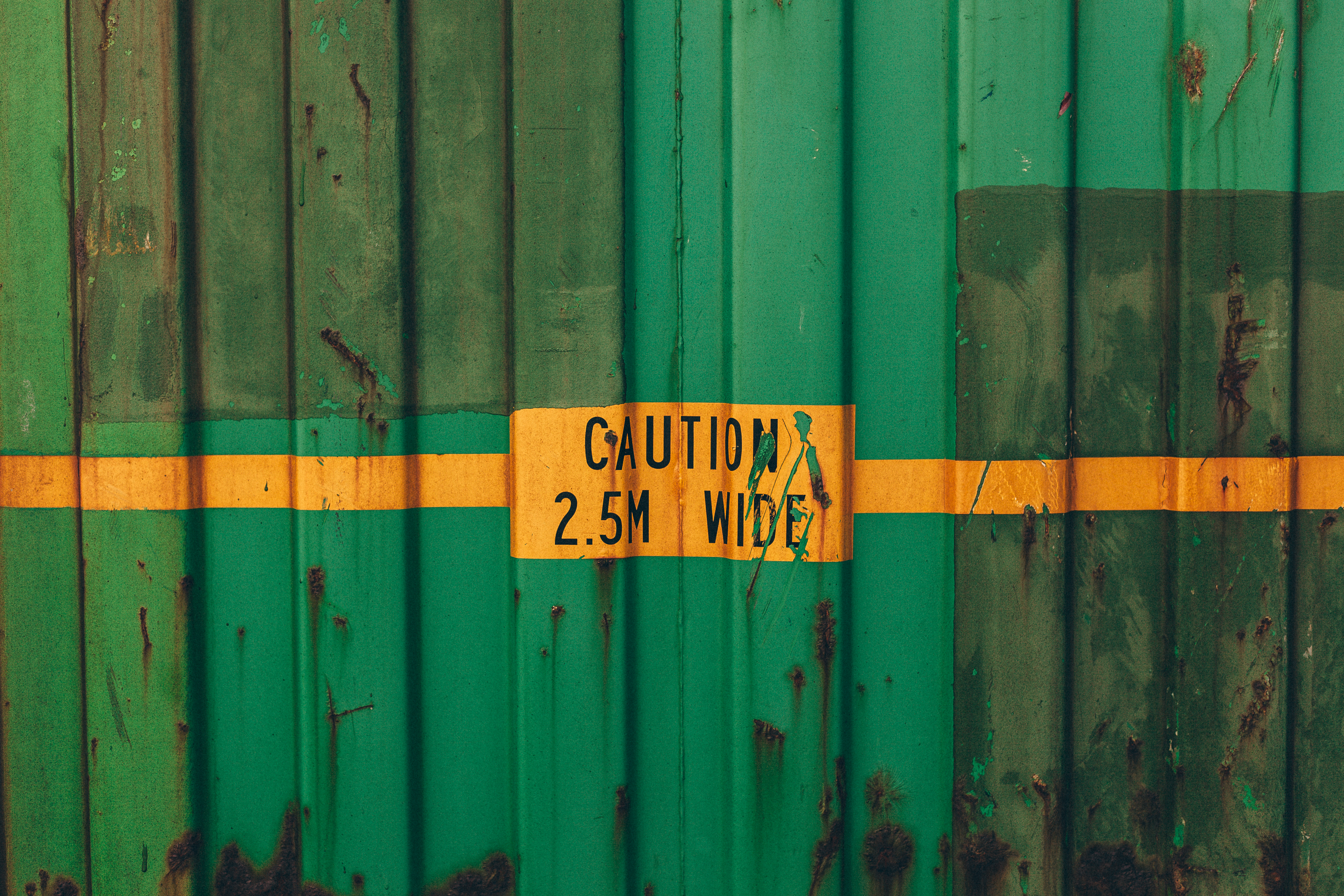Green rusted shipping container photo