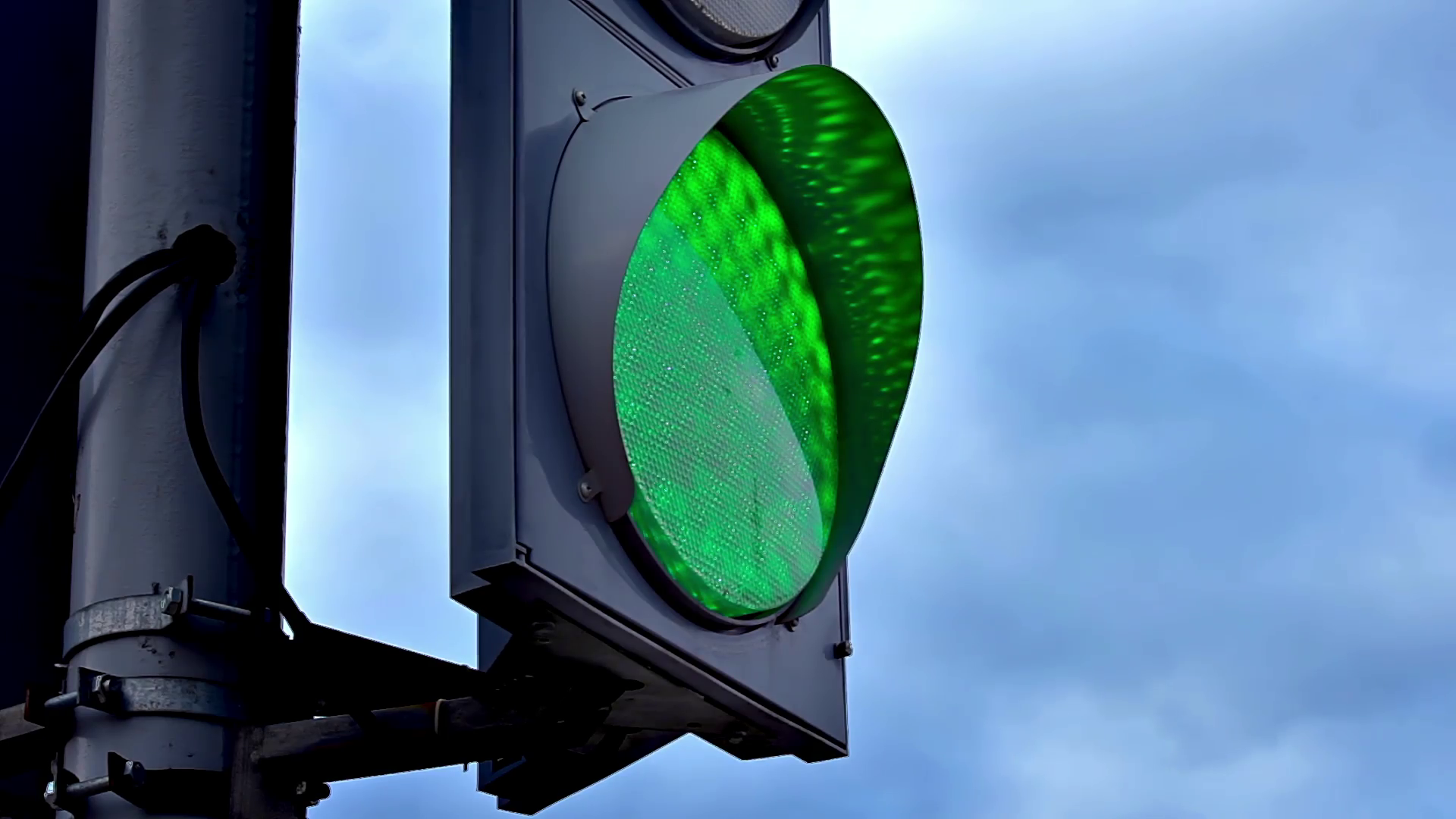 Traffic lights at road crossings. Green light close-up. Blinking ...