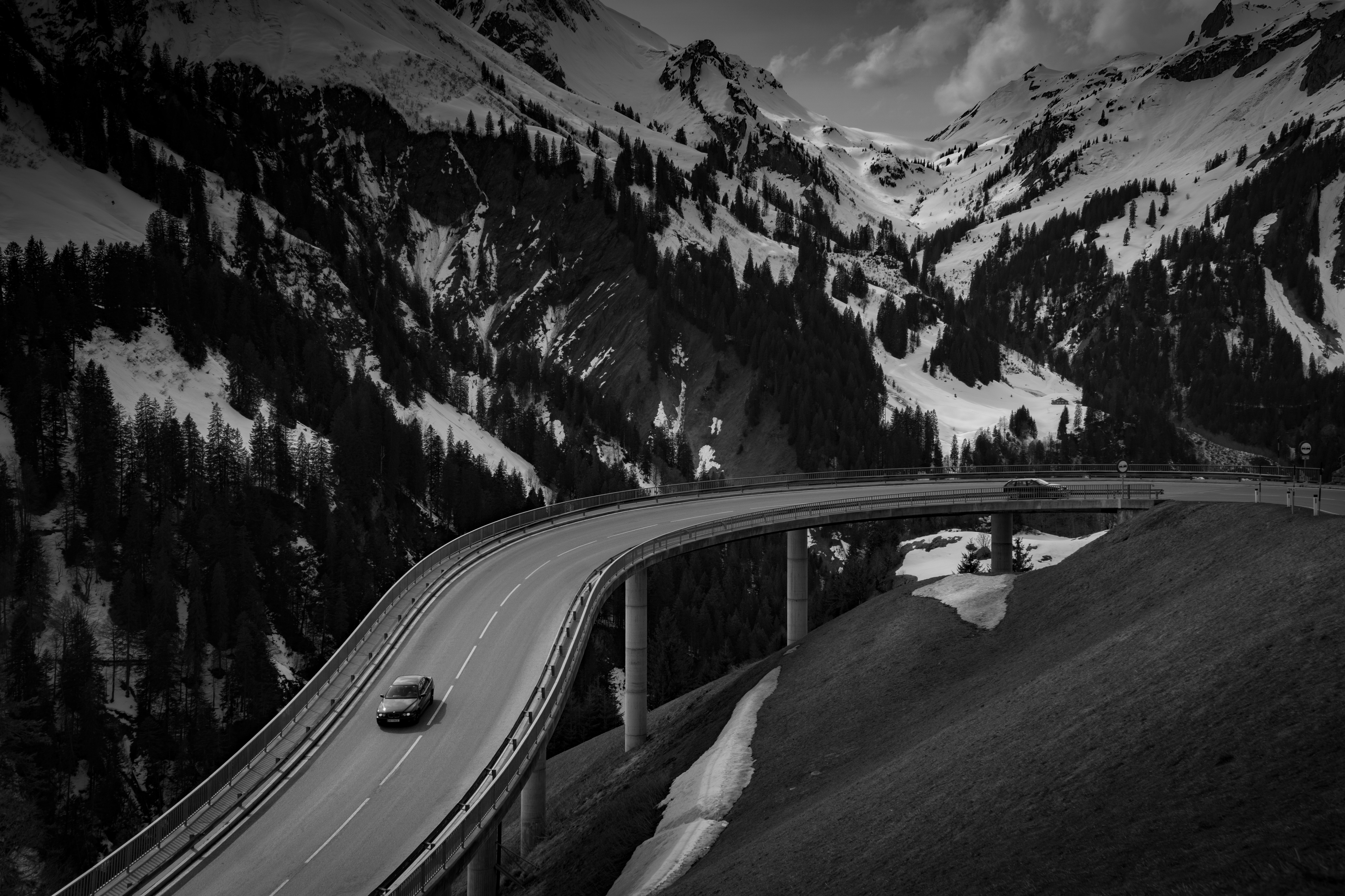 Grey car on road near snow covered mountain photo