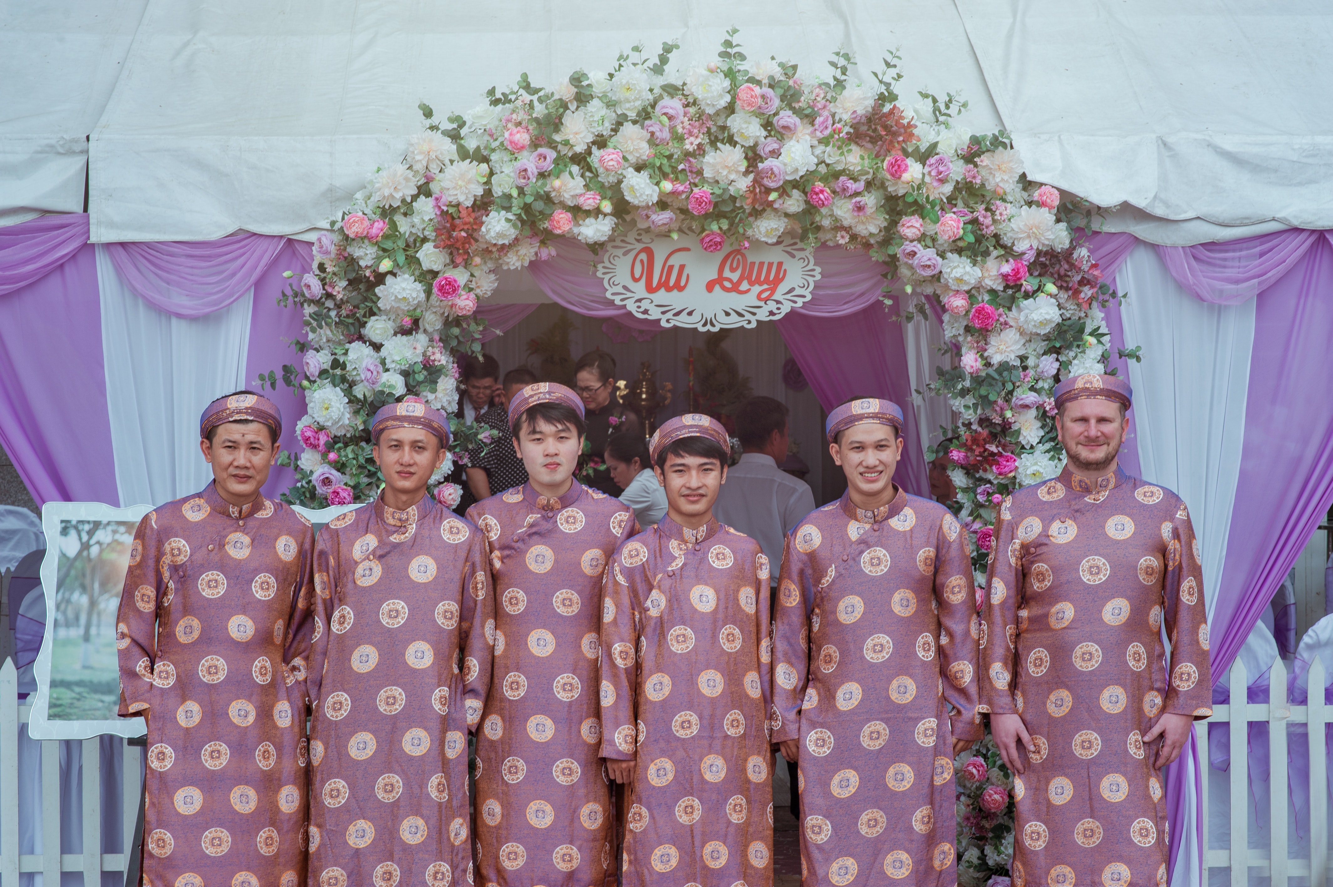 Group of men wearing pink robes photo