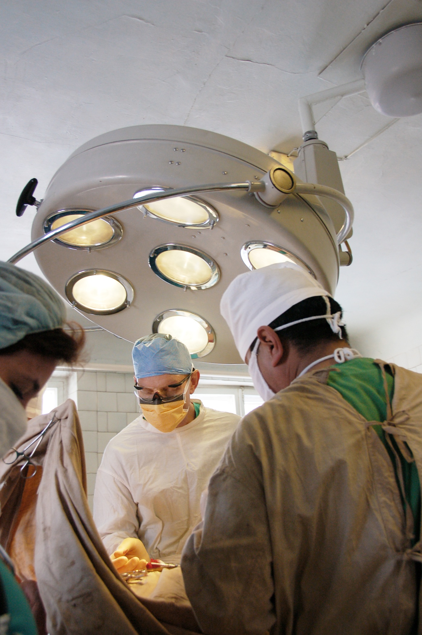Group of surgeons operating photo