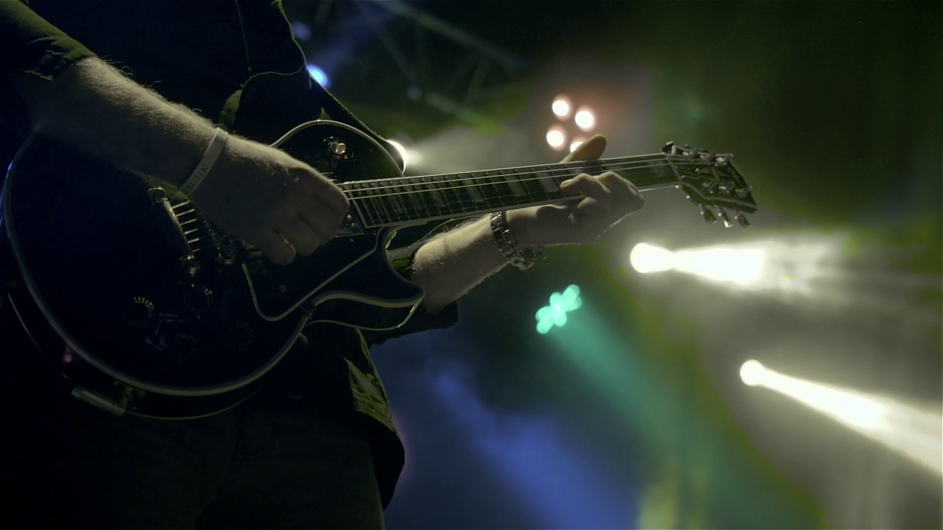 Silhouette of guitar player on stage. Dark background, smoke ...