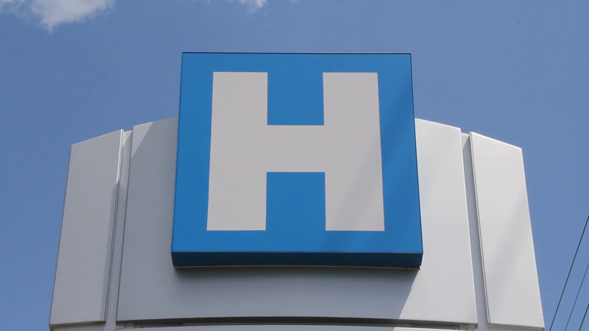 Hospital with universal H sign on it Stock Video Footage - Videoblocks