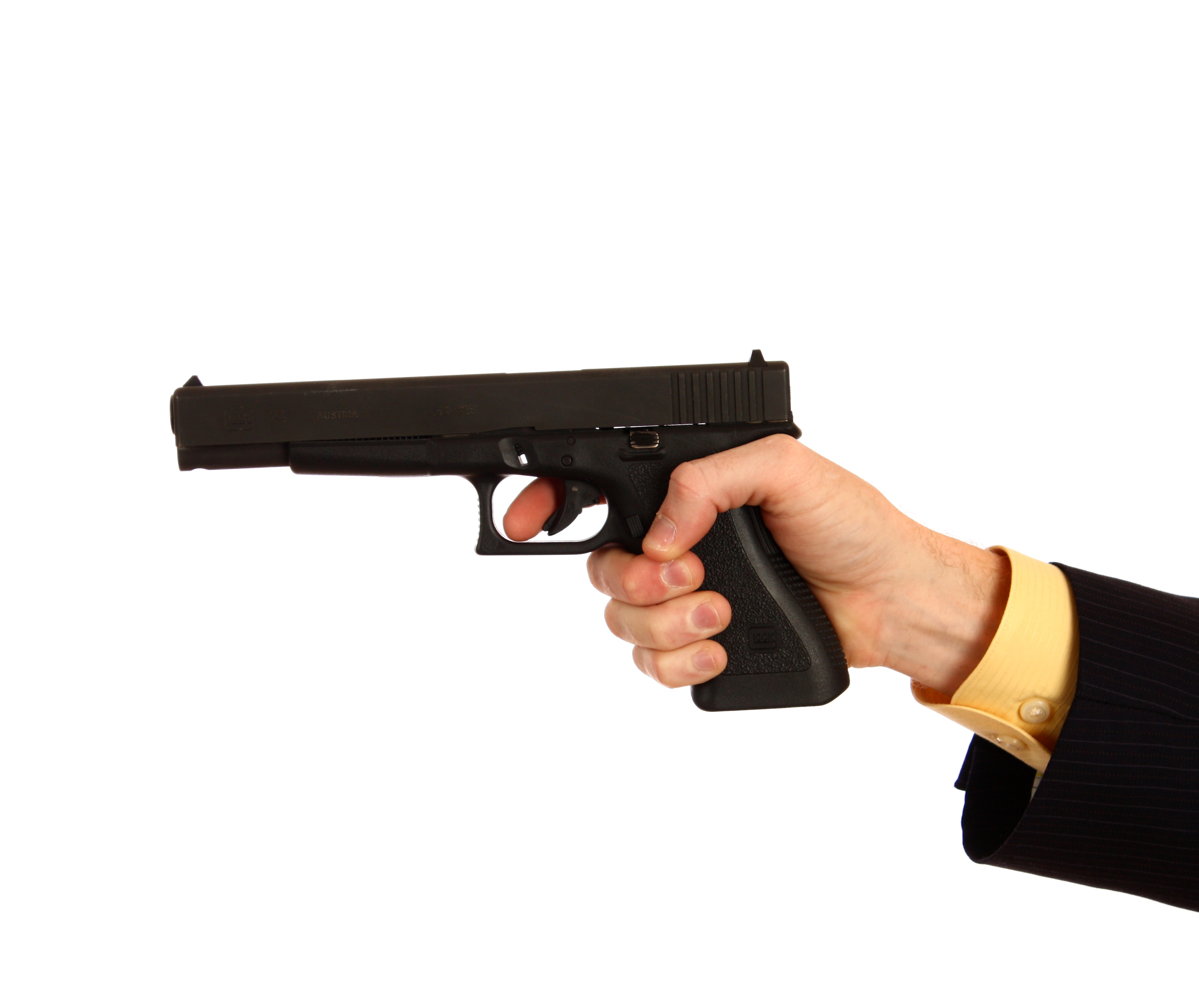 Hand in a business suit holding a pistol photo