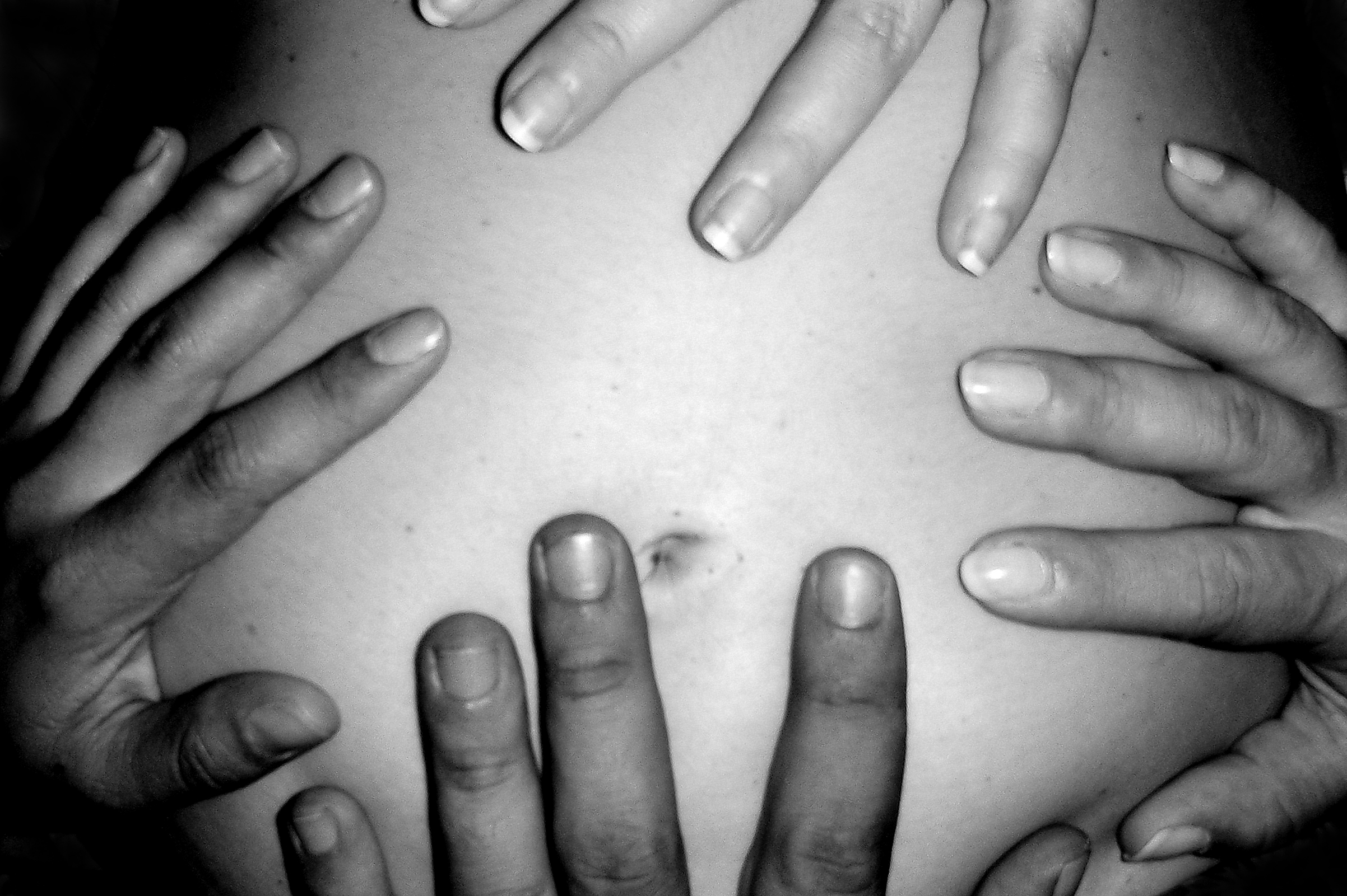 Hands on a pregnant belly photo