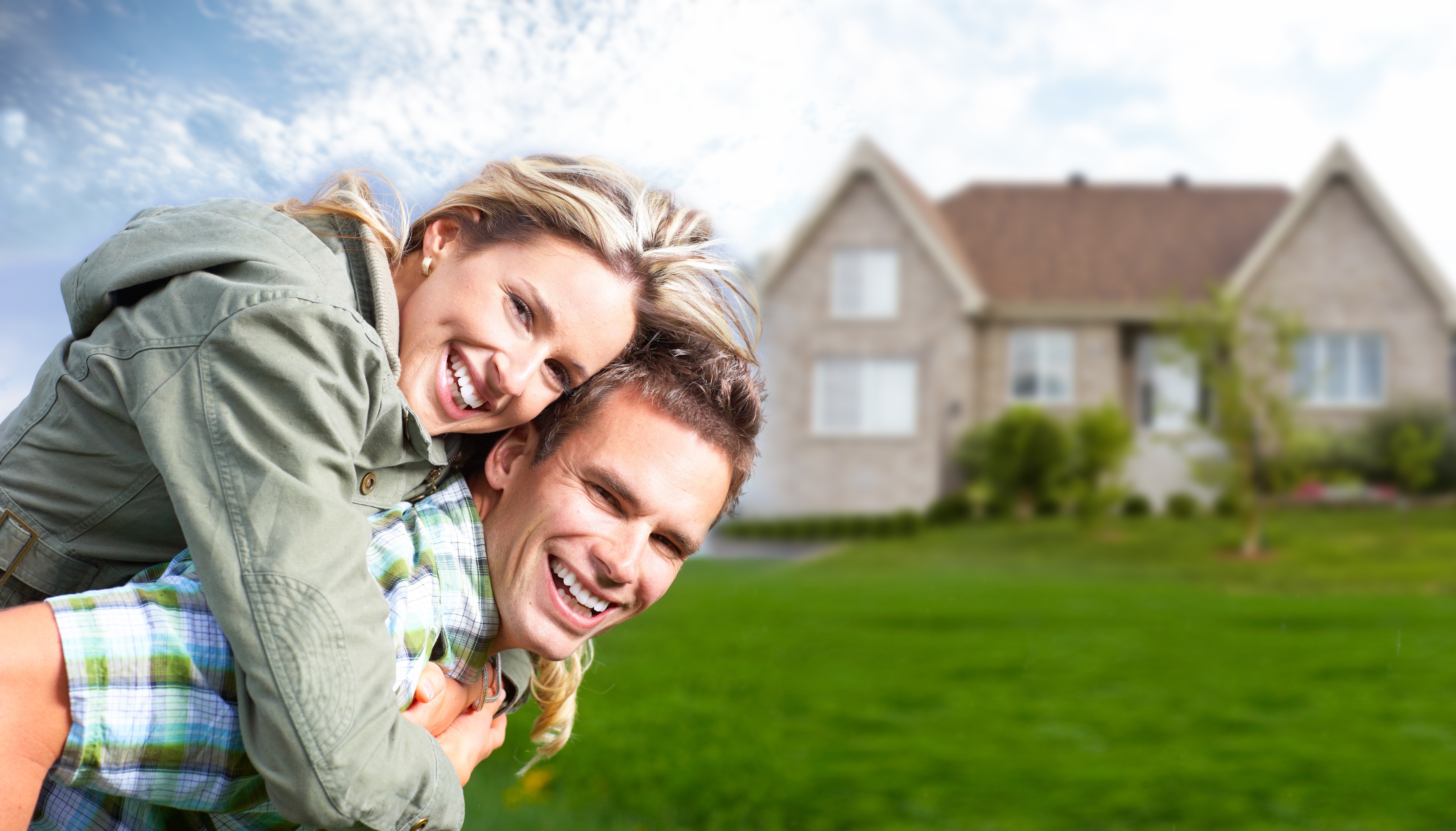 Happy Couple with House-Shutterstock - Davinci Homes LLC