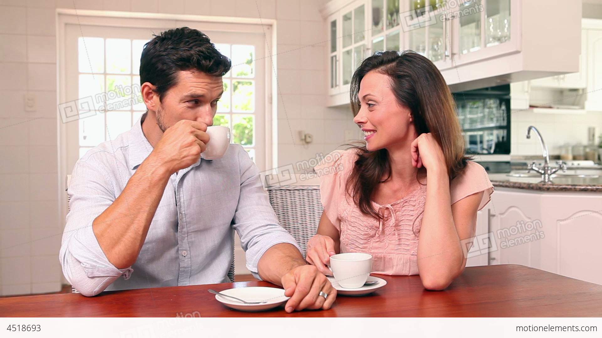 Happy Couple Drinking Coffee Together Stock video footage | 4518693