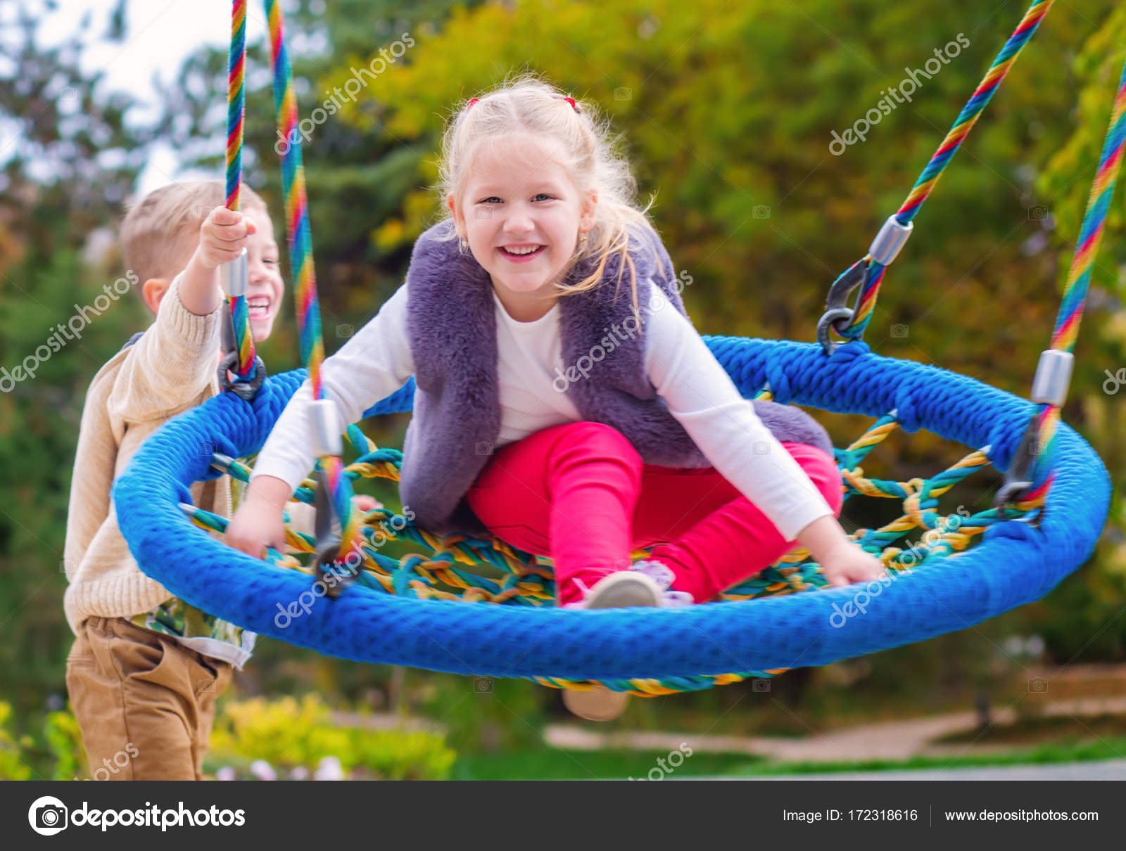 two happy little children having fun on a swing — Stock Photo ...