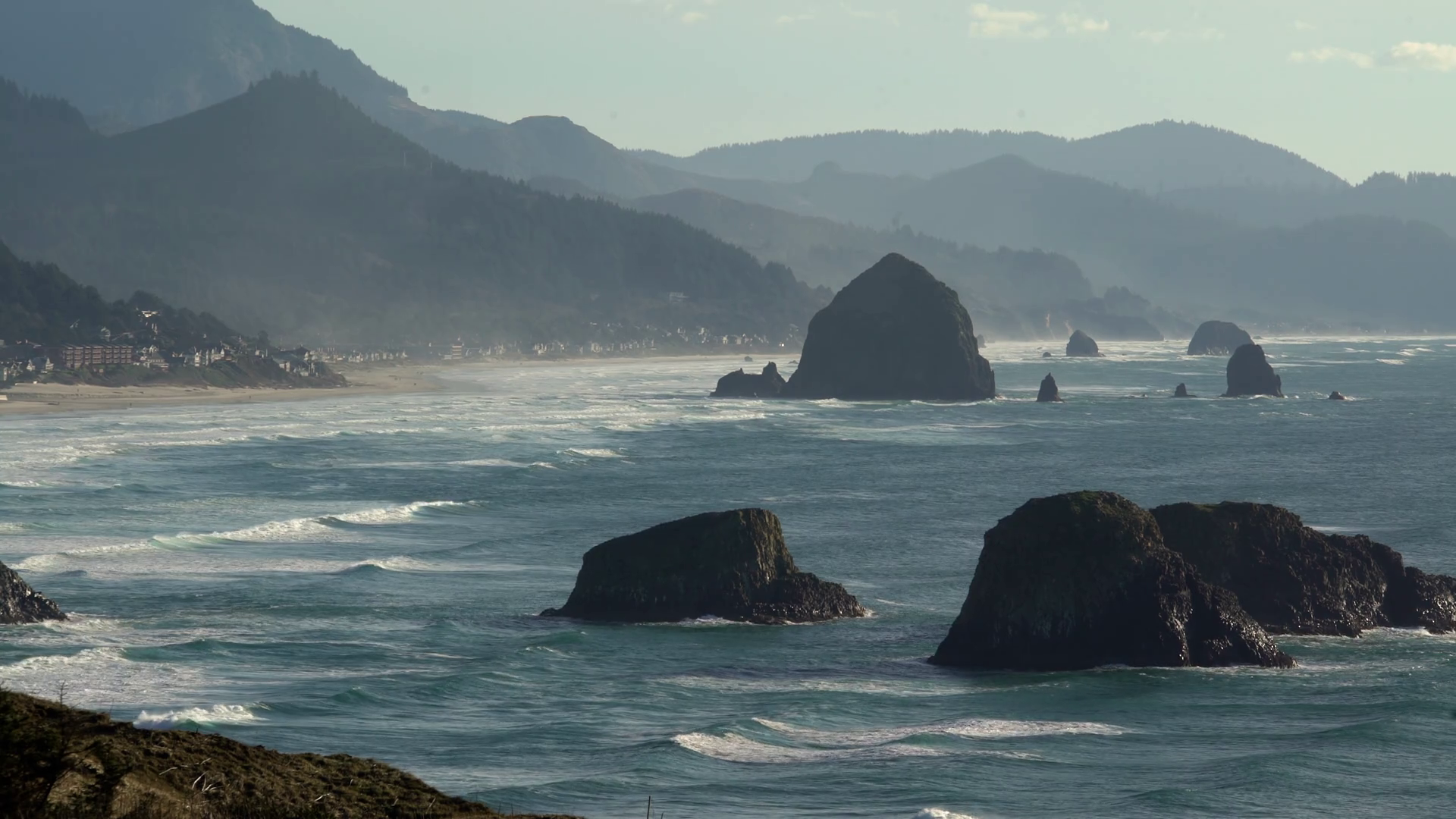 Haystack Rock and Pacific Coastline. Though a calm, sunny winter day ...