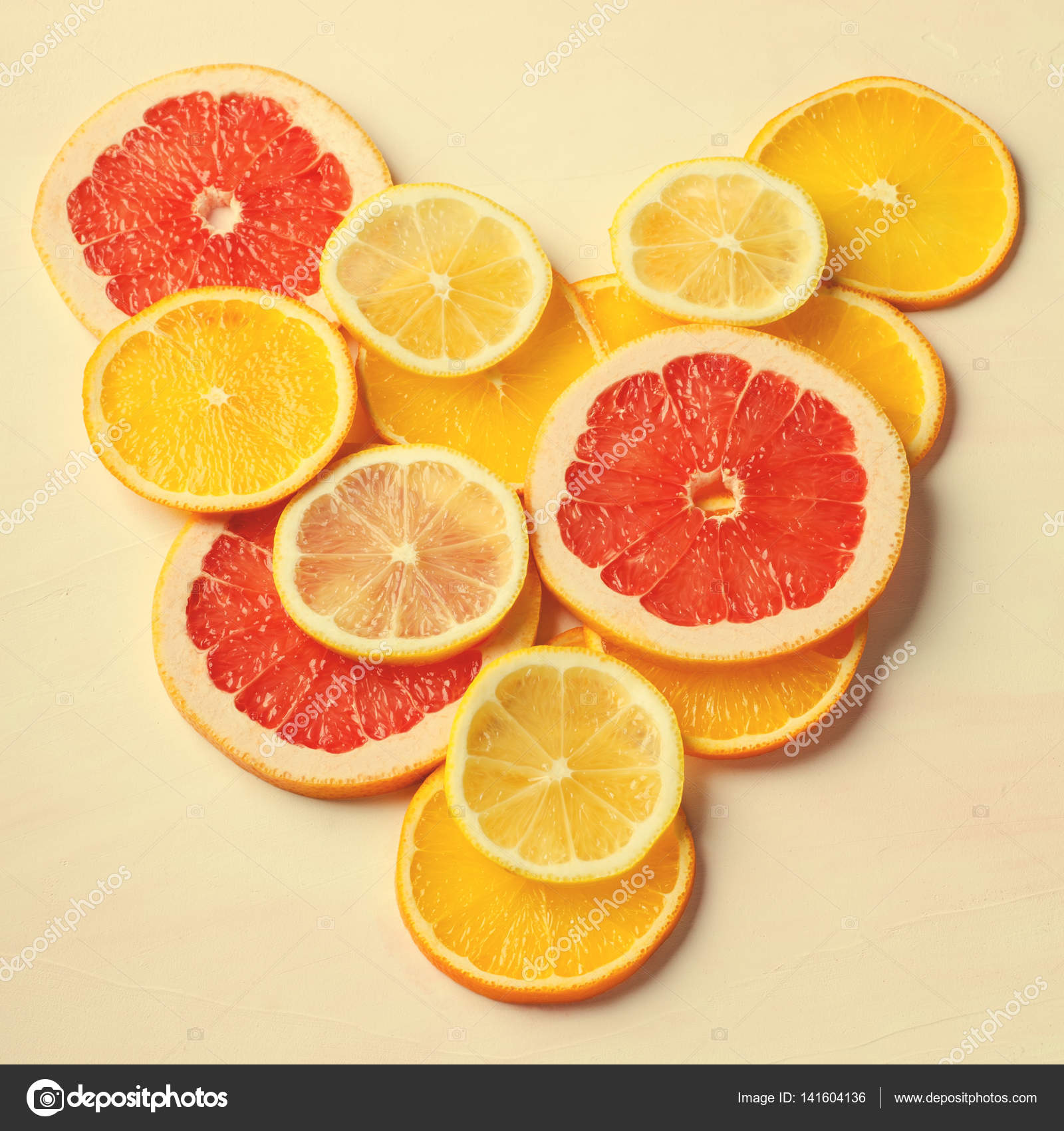 Citrus fruit Heart from slices of lemon, orange, grapefruit on white ...