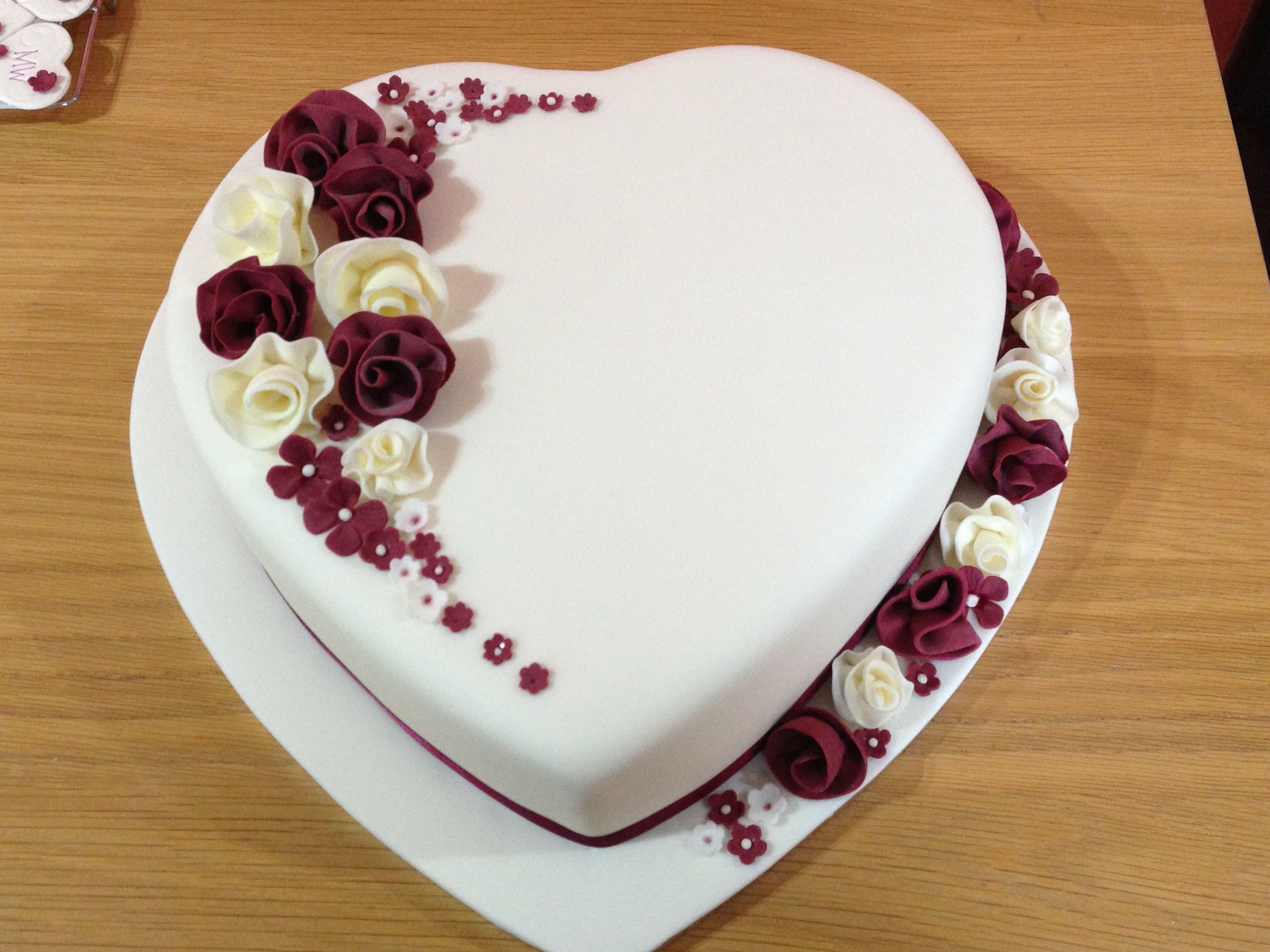 Heart shaped wedding cake with whimsical flowers - Fondant covered ...