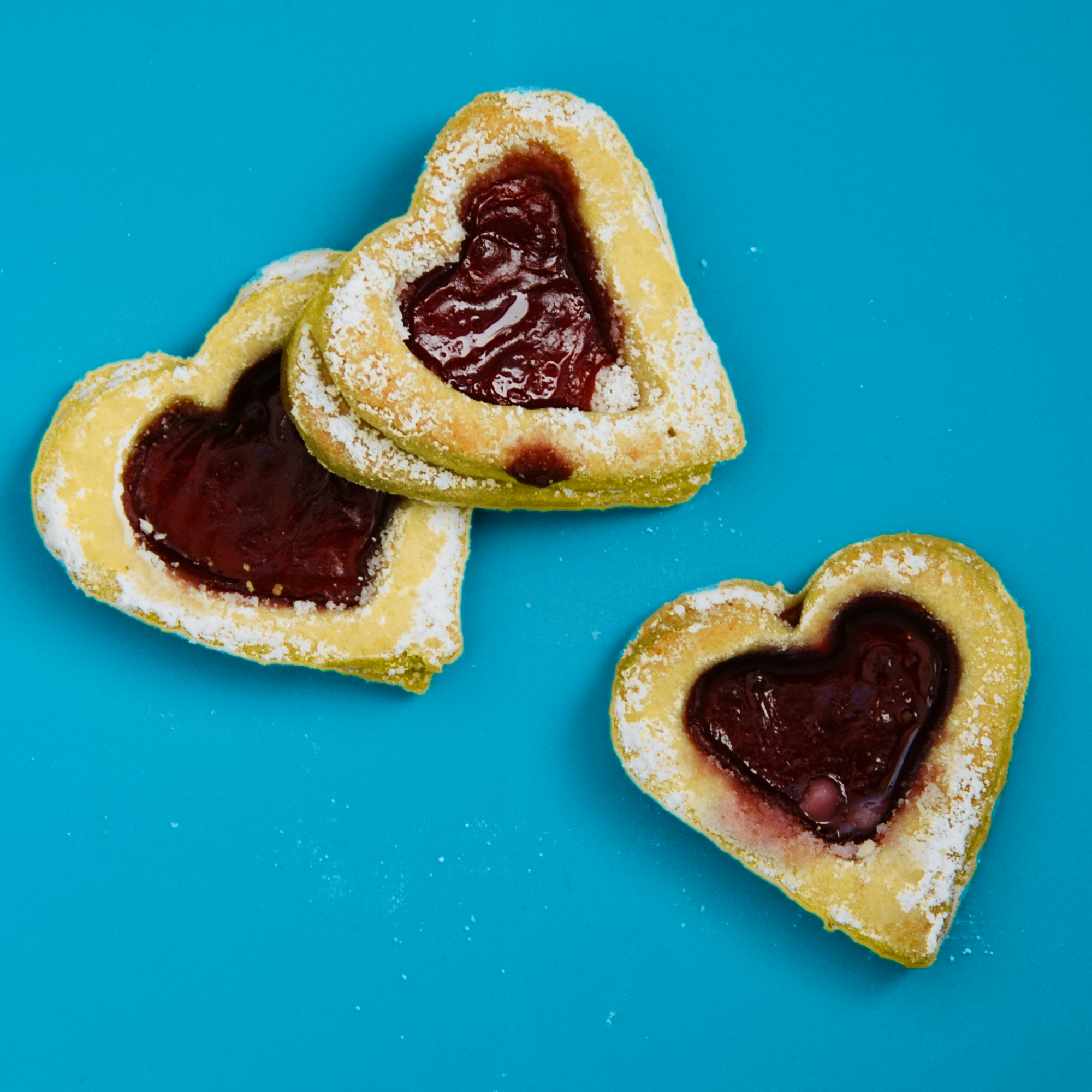 Heart shaped cookies on blue surface photo