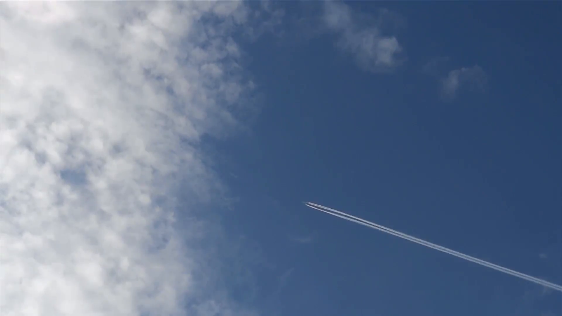 Jet airliner disappears through the clouds at high altitude 9 Stock ...
