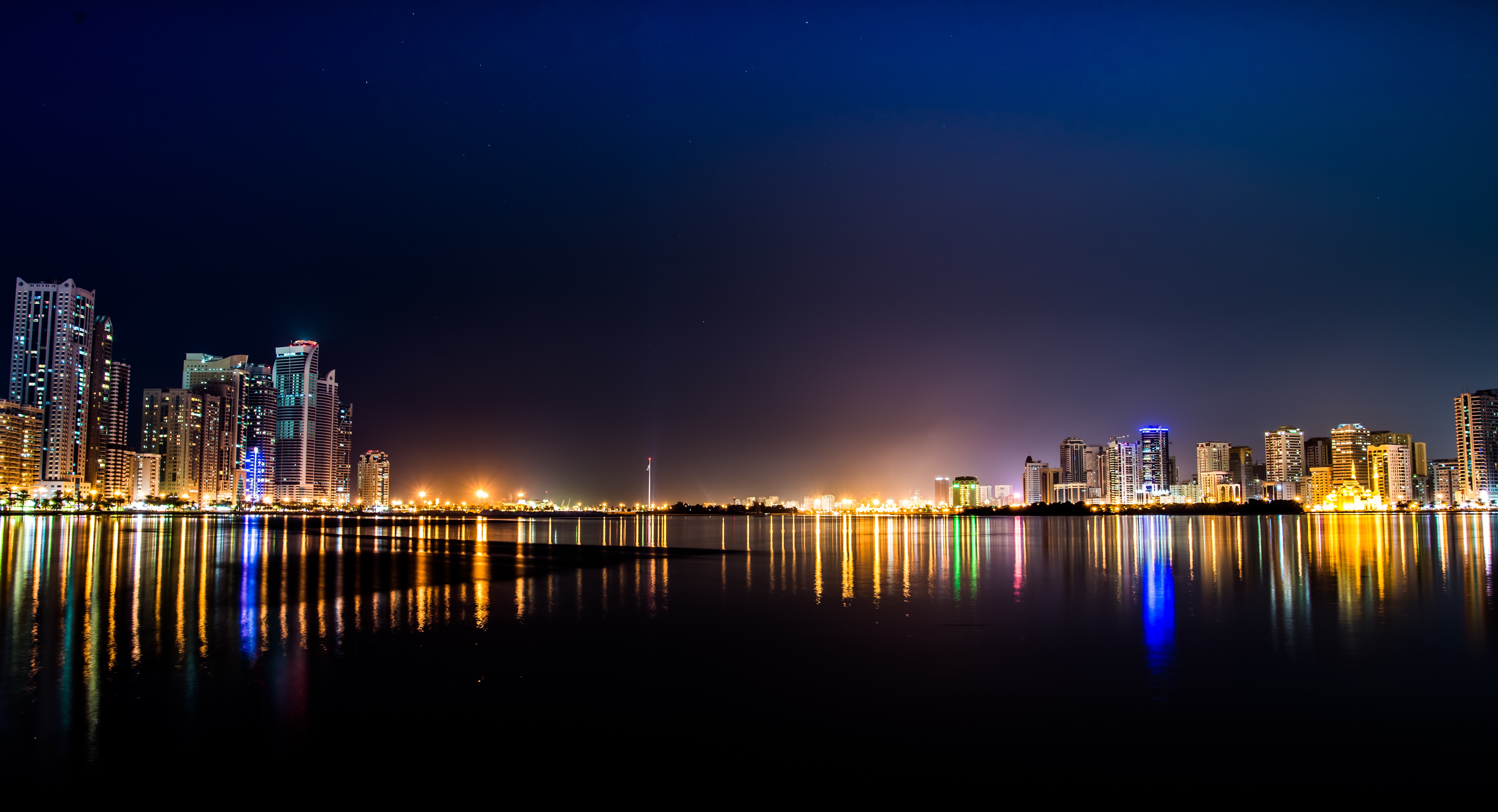 High rise buildings across body of water photo