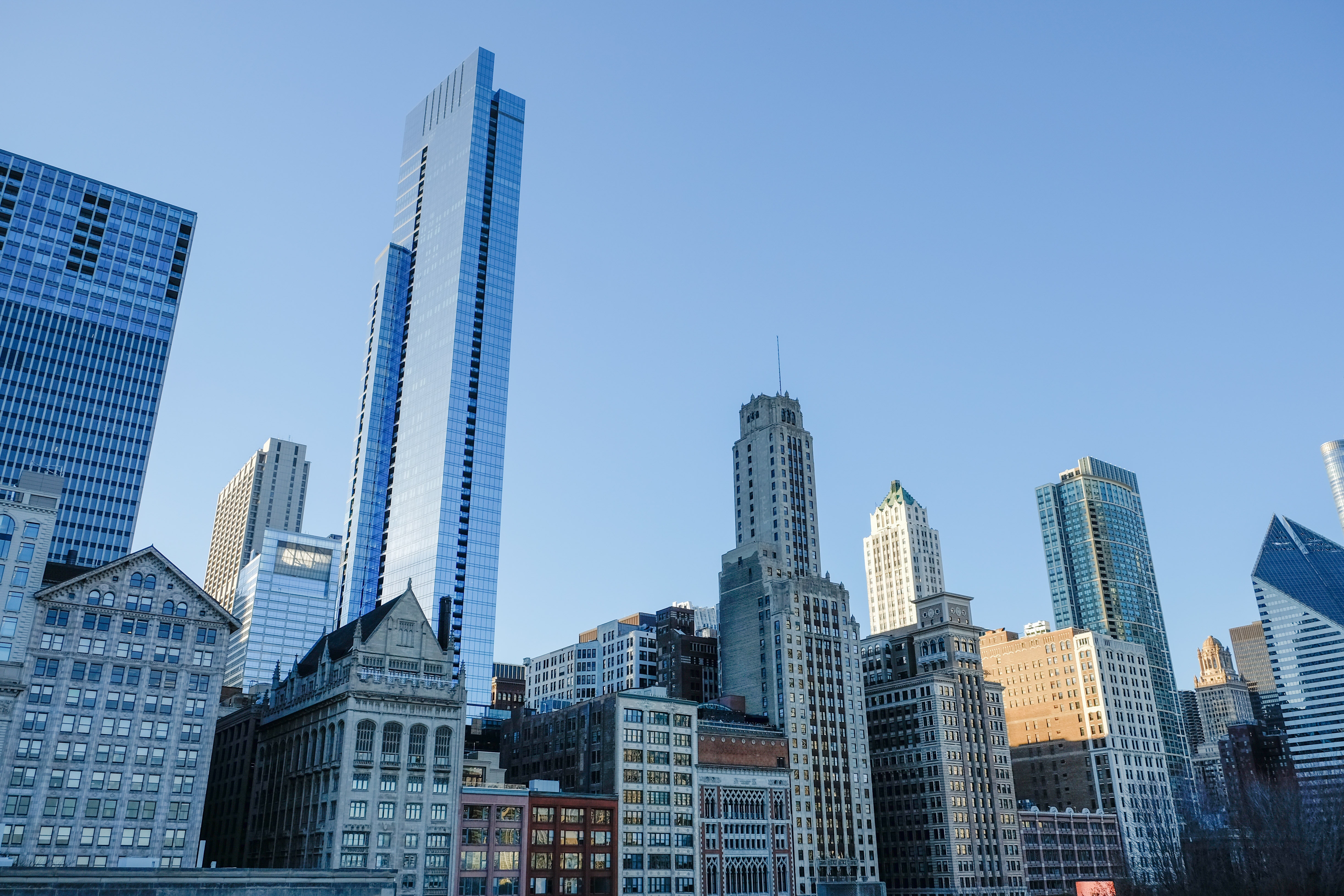 High-rise buildings under clear blue sky photo