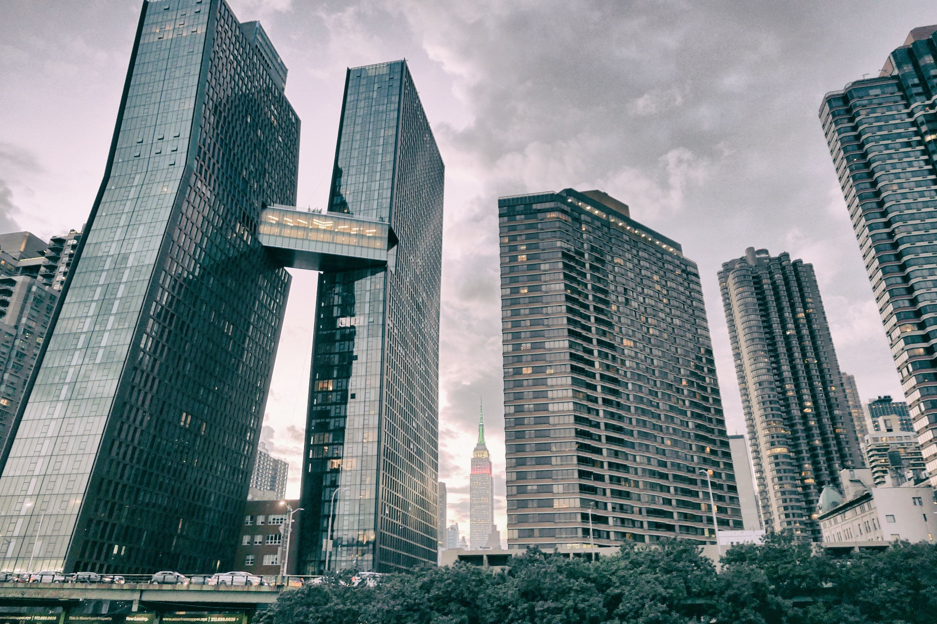 High rise buildings under cloudy sky photo