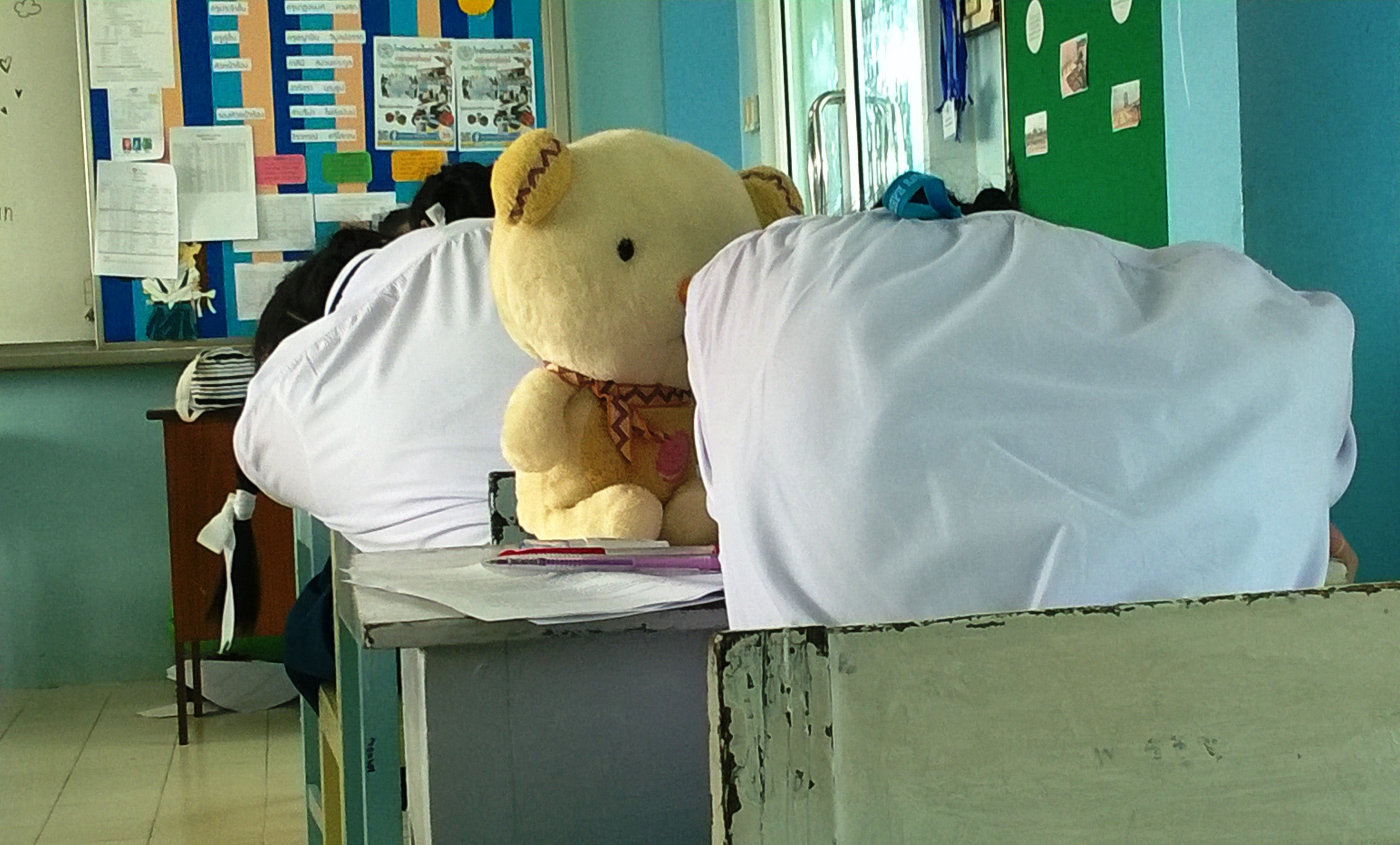High-school girl students sleep during an exam photo