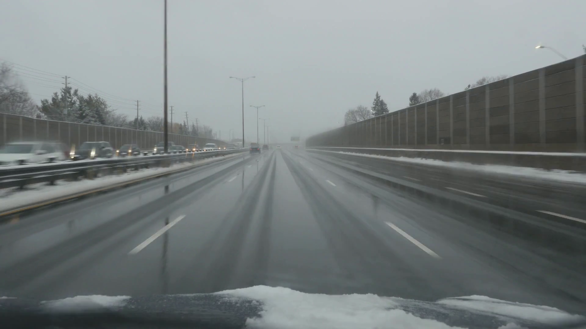 Driving on wet, winter highway. QEW going west. Toronto, Canada. No ...