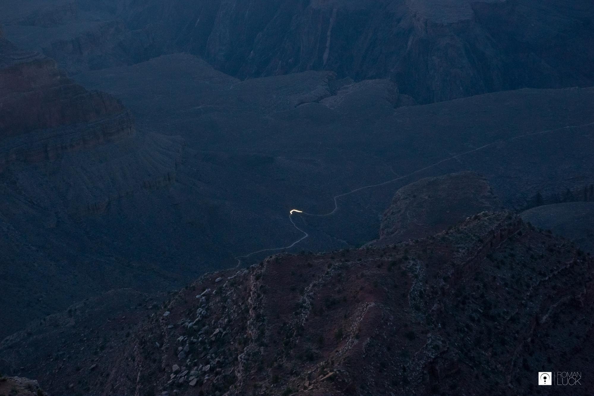A hiker making his way through the deapths of Grand Canyon. This ...