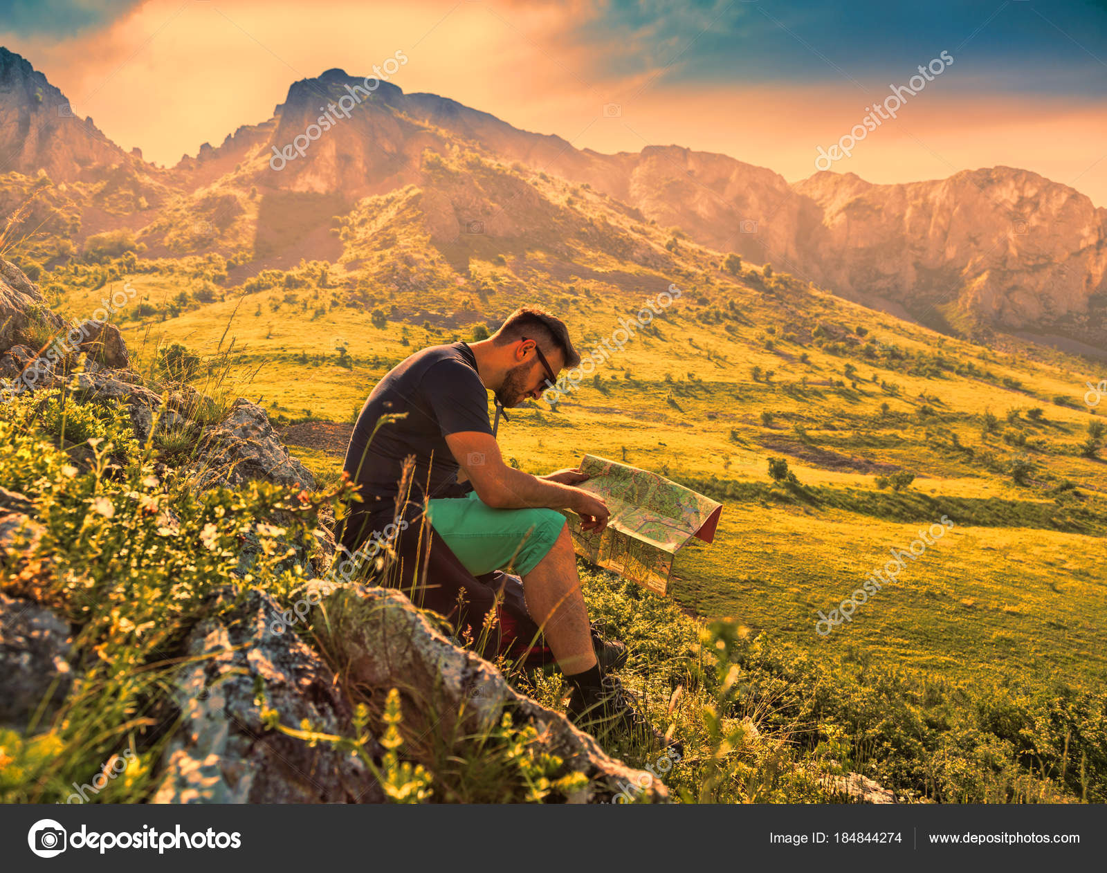 The Hiker with a Map in Misty Mountains — Stock Photo © razvanphoto ...