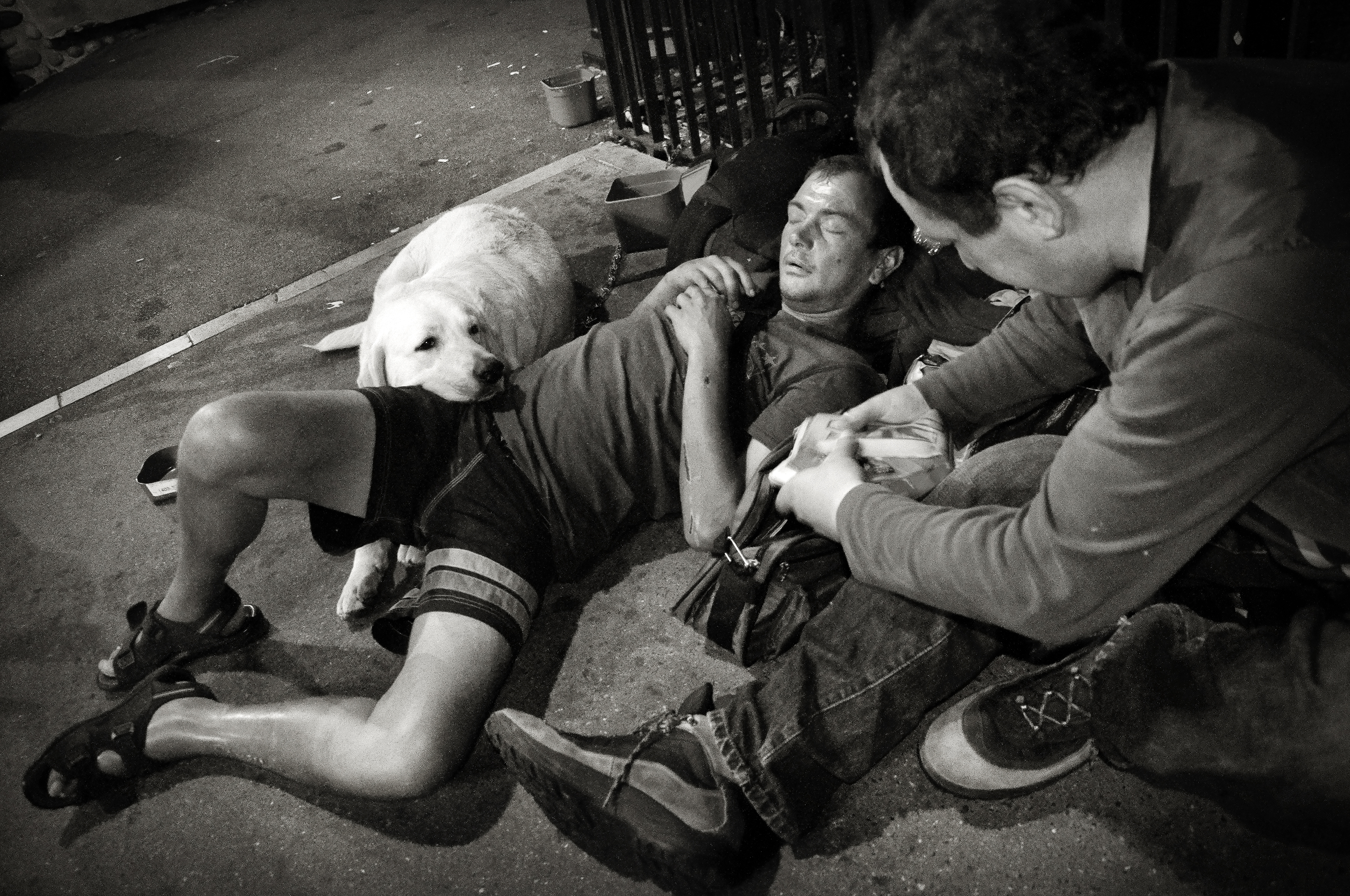 Homeless men with dog photo