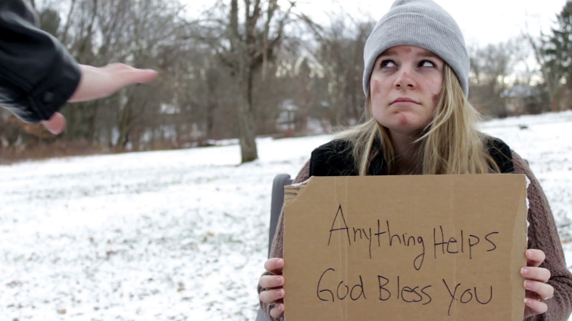 Man Walks By Begging Homeless Woman In Local Park During Winter ...