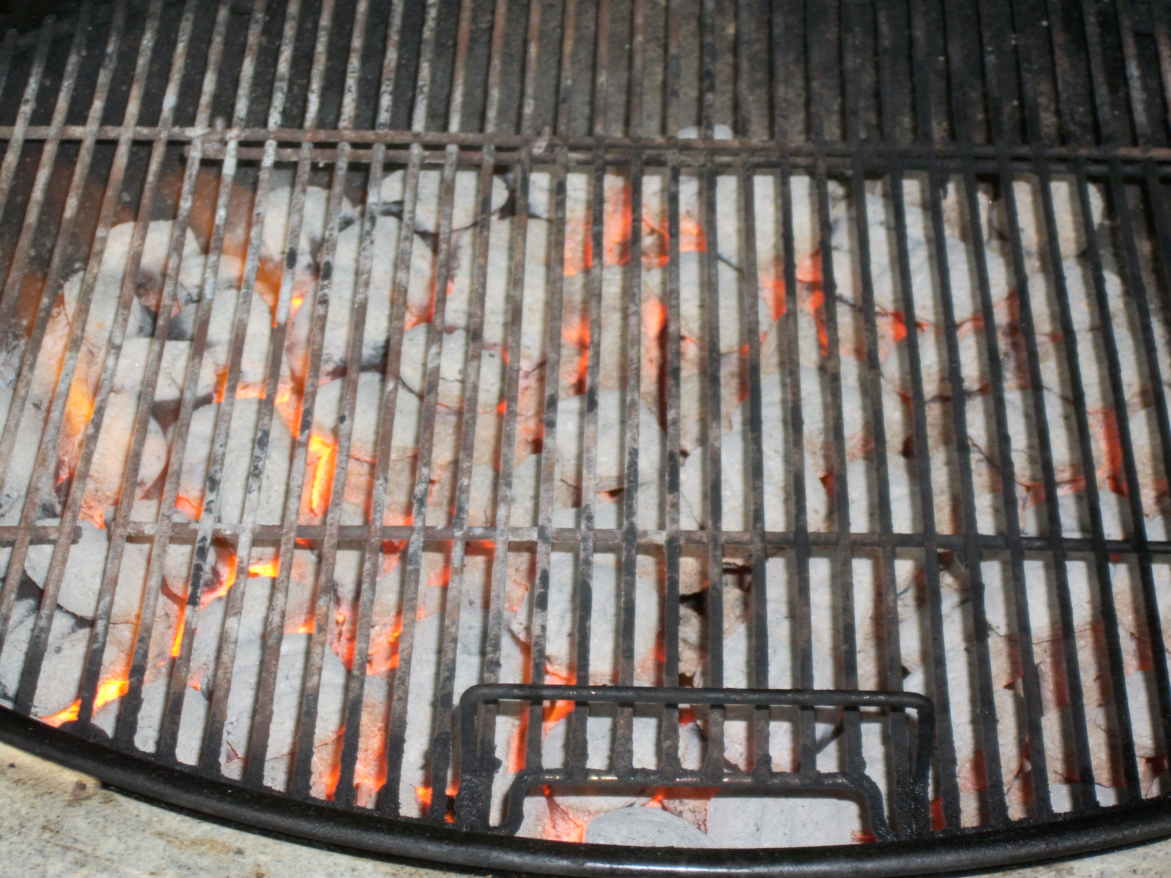 Hot coals in grill photo