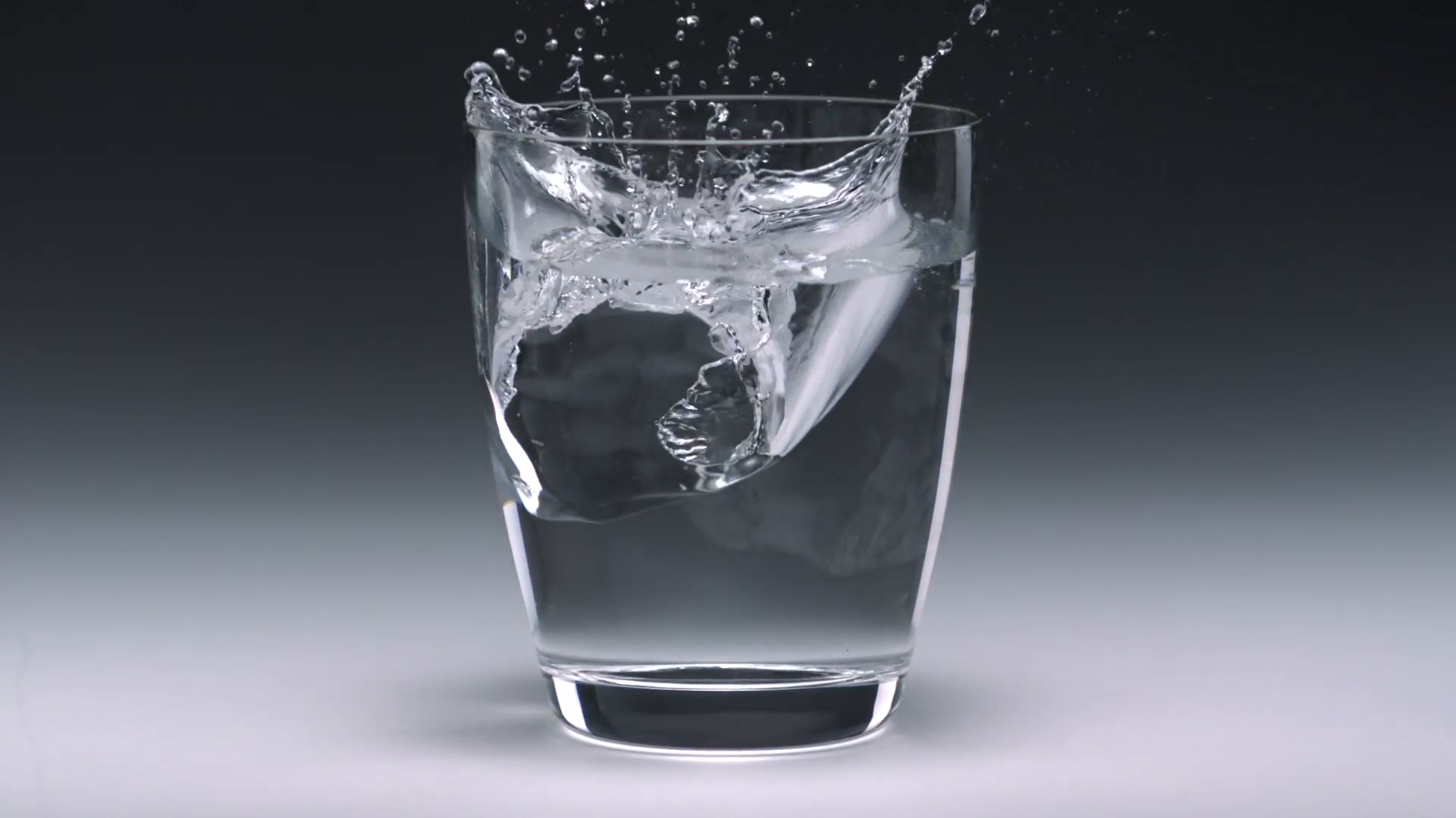 Ice cubes in a glass with water - Slow Motion Stock Video Footage ...