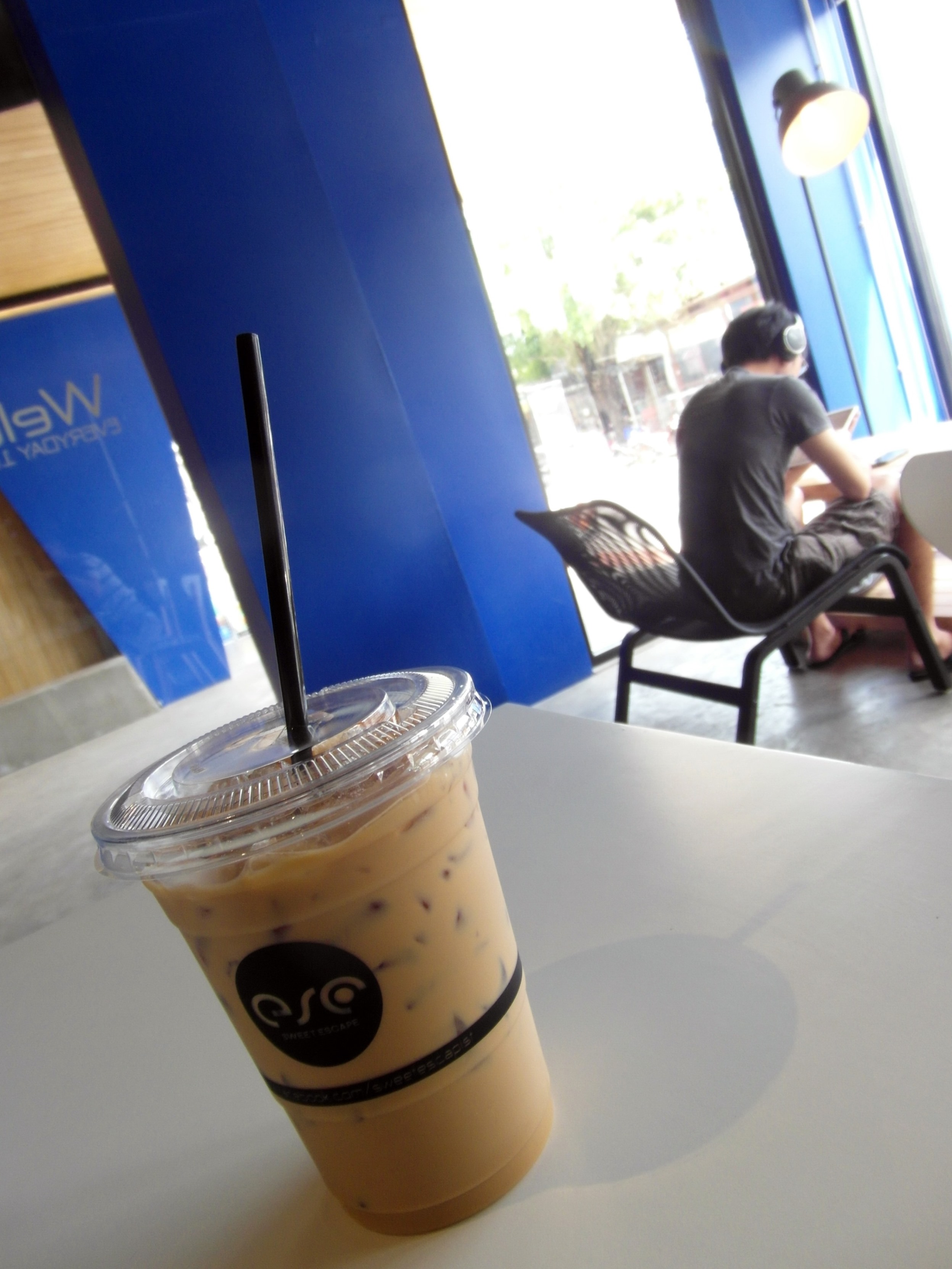 Iced coffee and customer in a cafe photo