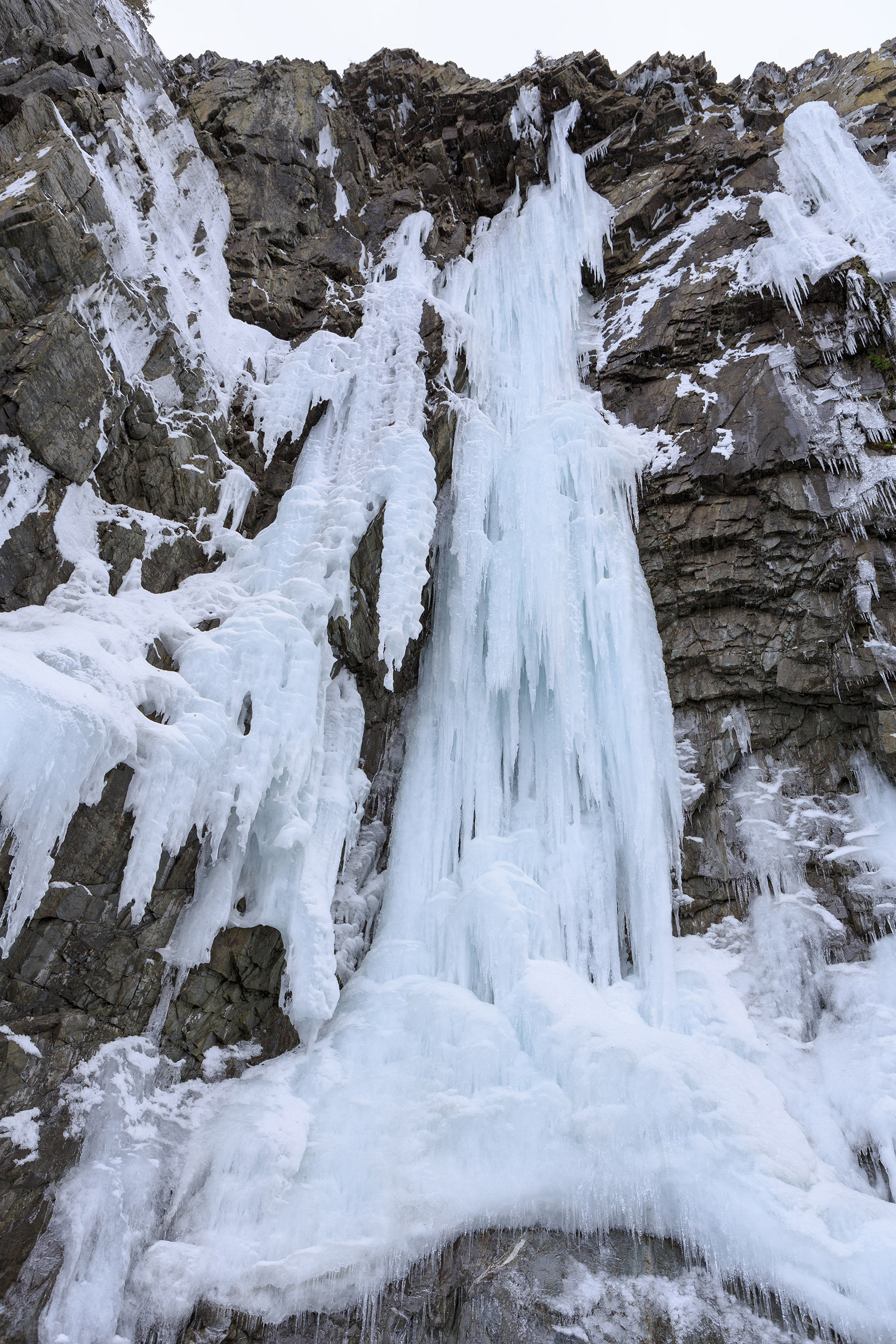 Icicles on a wall of rock photo