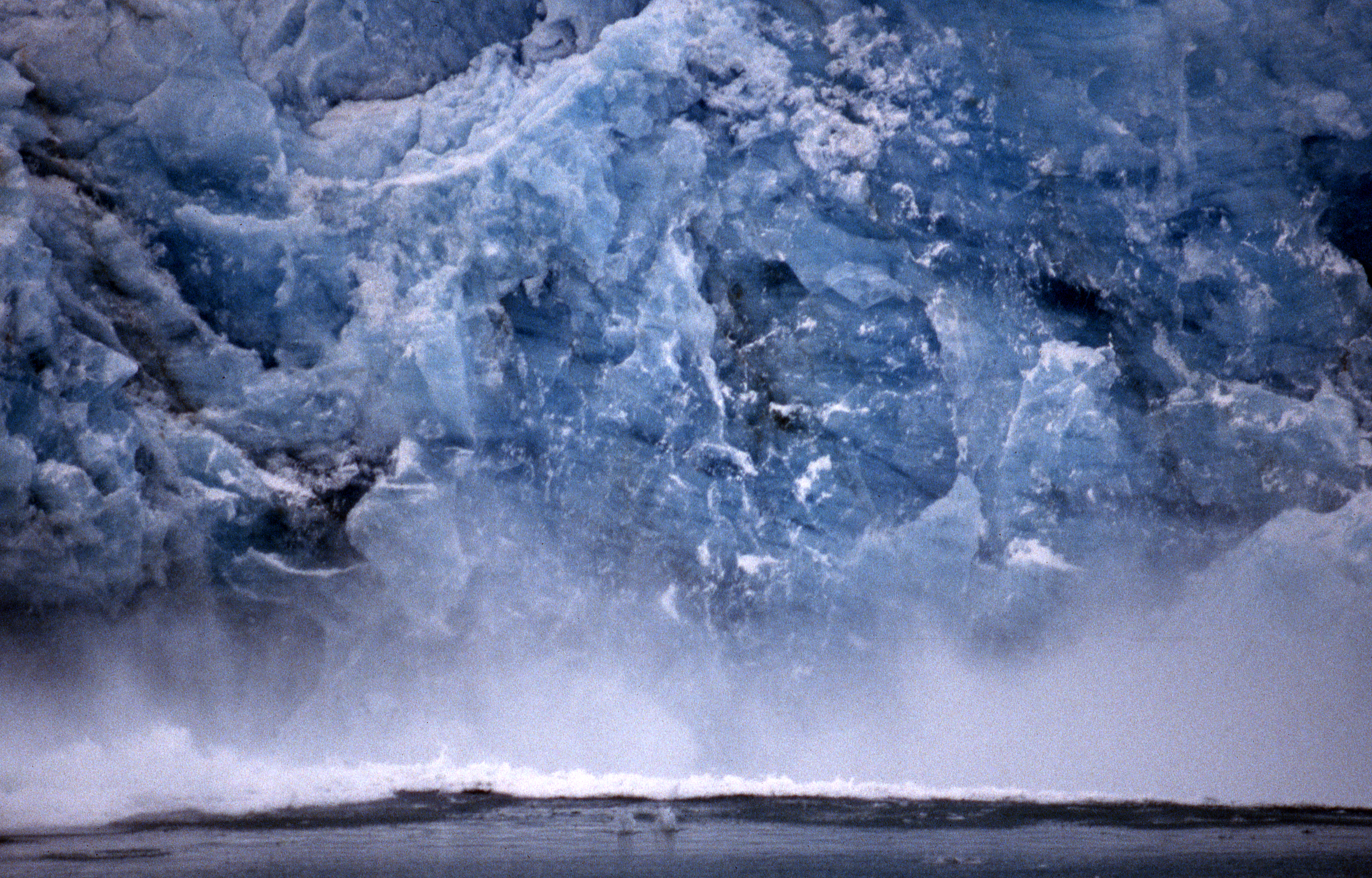 Ice blocks falling from a glacier front in Svalbard | GRID-Arendal