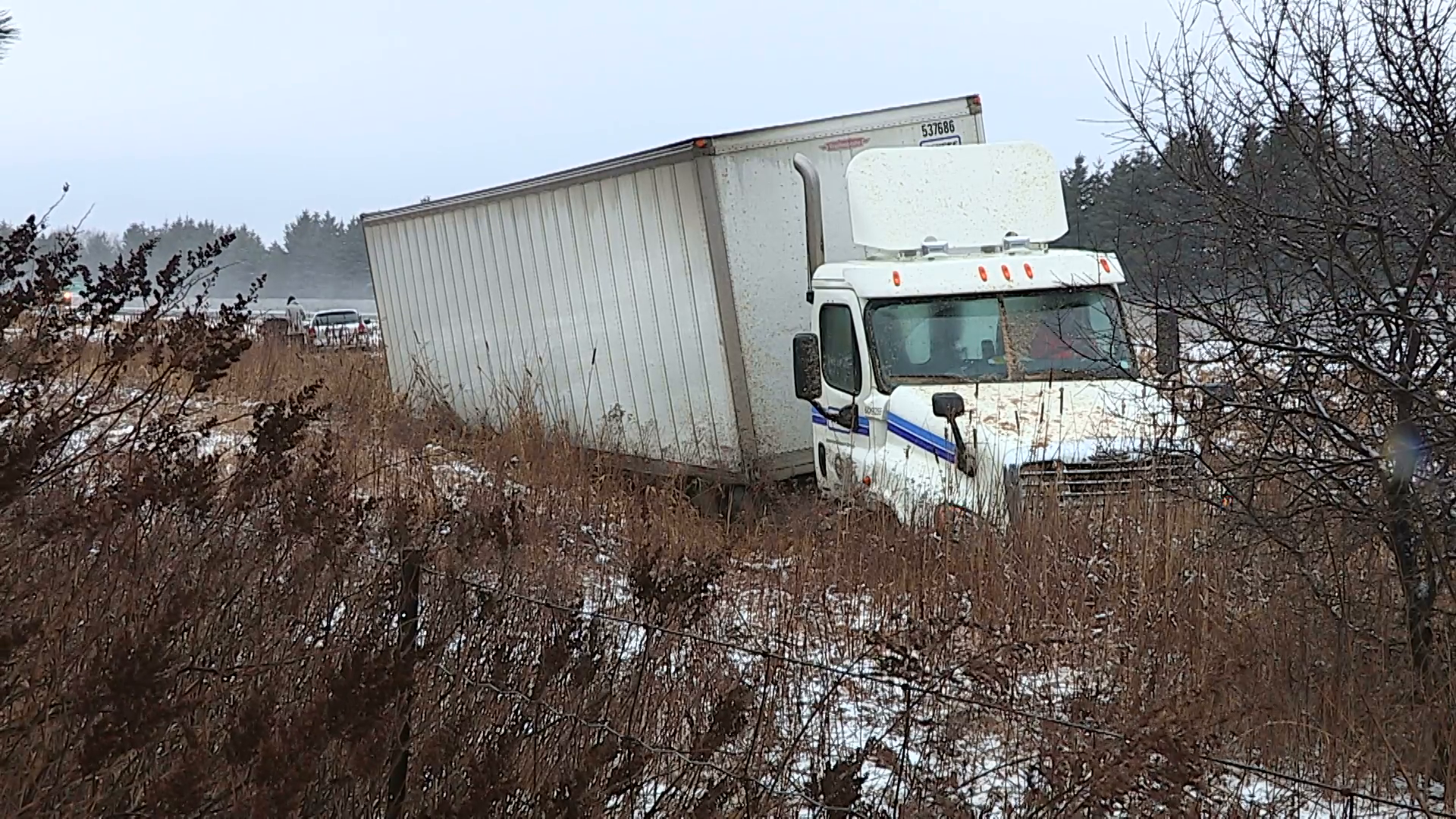 Tractor trailer truck crash and in ditch on icy road after blizzard ...