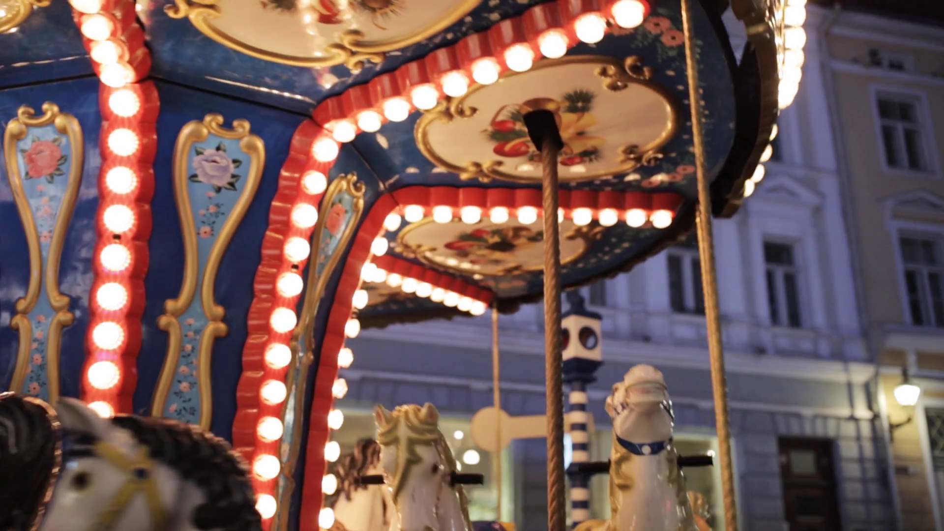 entertainment and amusement concept - illuminated carousel in old ...
