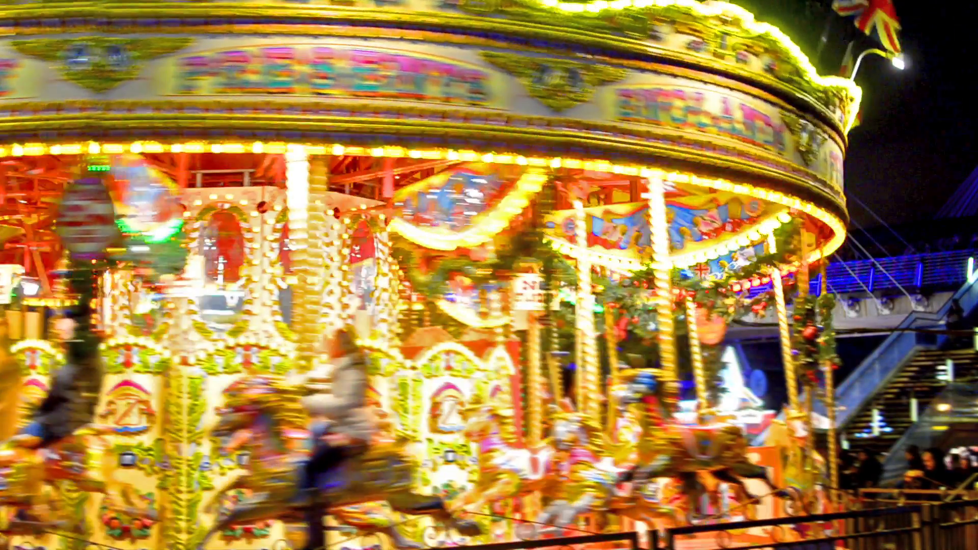 medium shoot of carousel turning around illuminated at Stock Video ...
