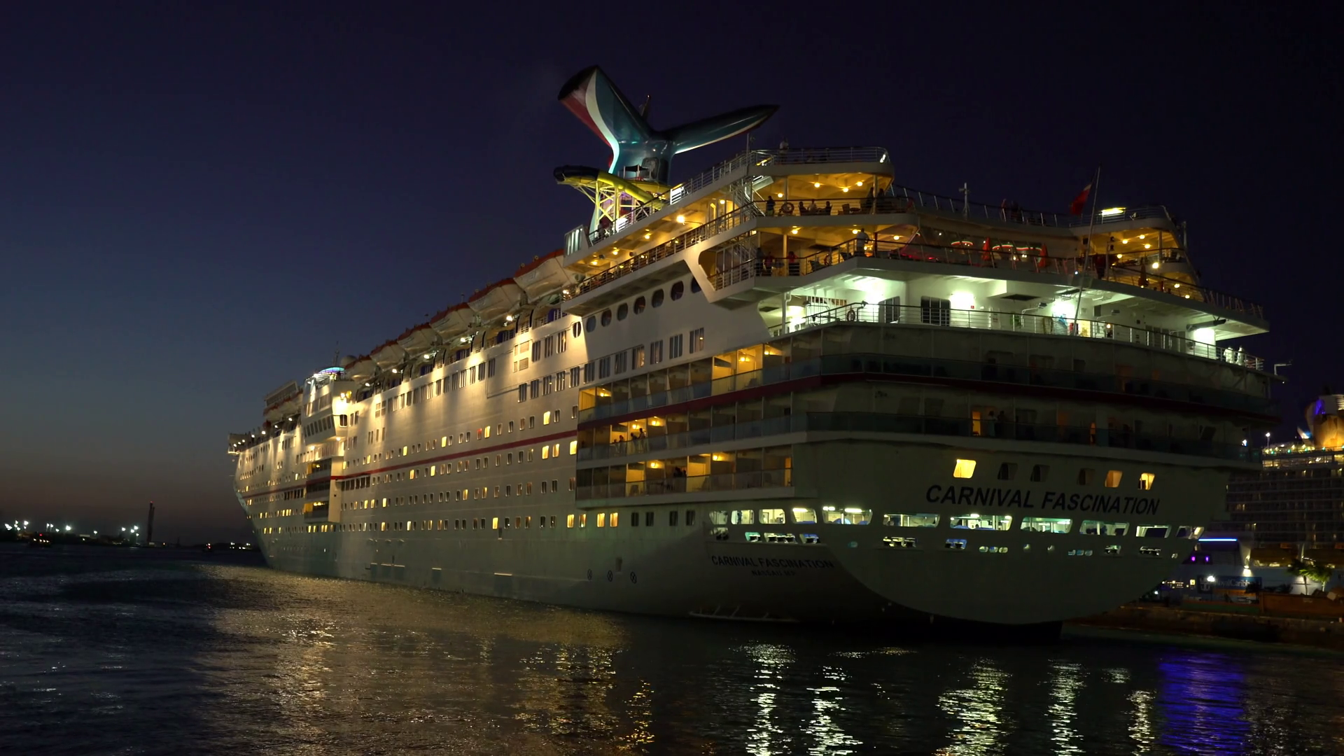 Illuminating cruise ship in the port at night - Anthem of the seas ...