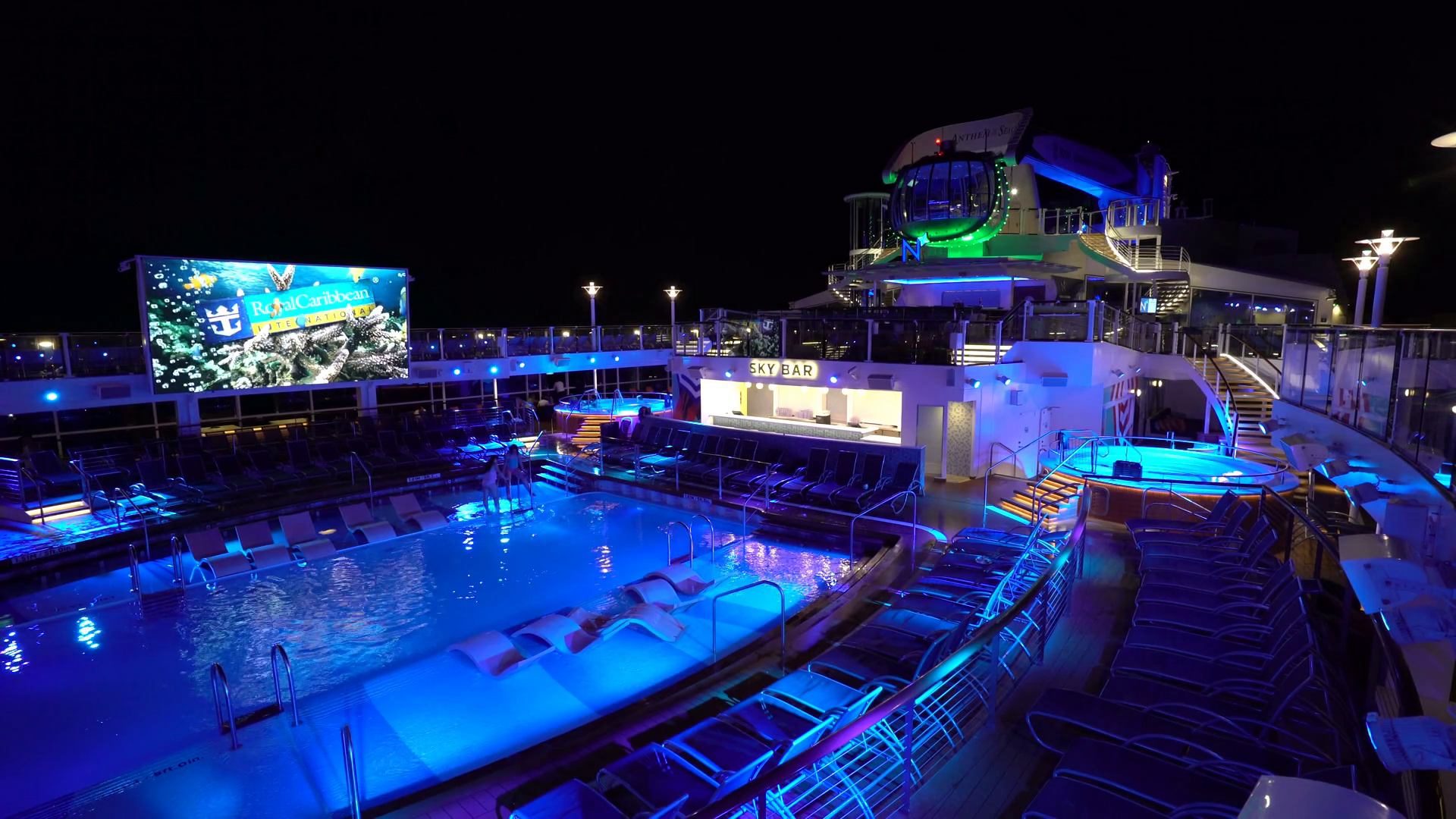 Illuminating cruise ship pool deck at night - Anthem of the seas ...