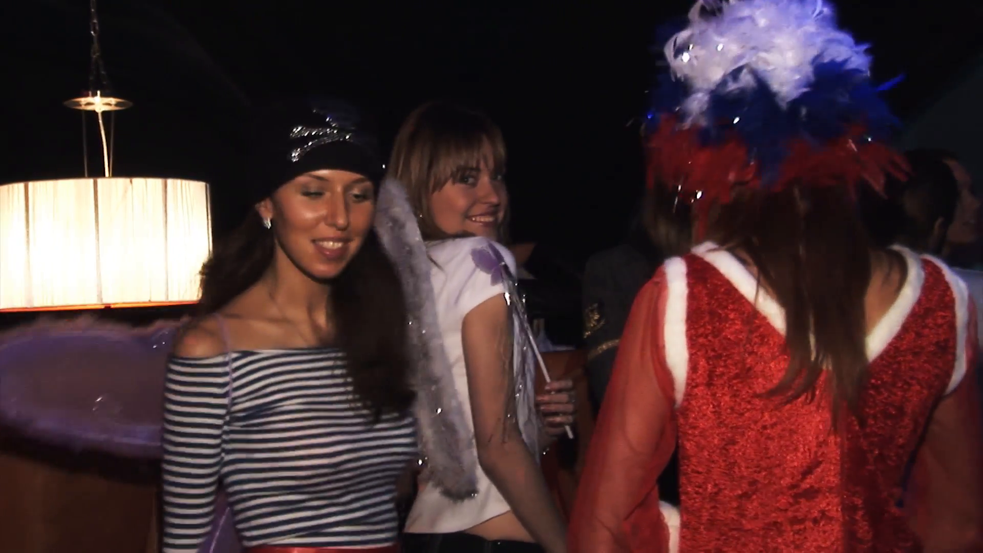 People in costumes dance at Halloween party in nightclub. Realistic ...