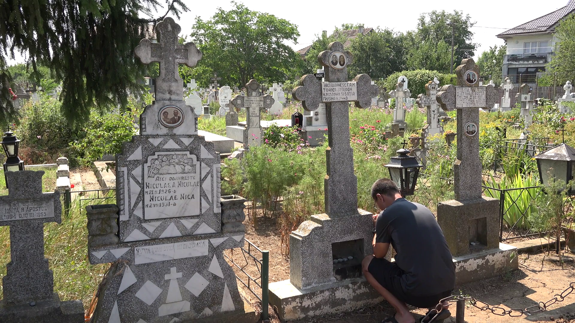 Man praying in the cemetery near his family cross, 4k, UHD Stock ...