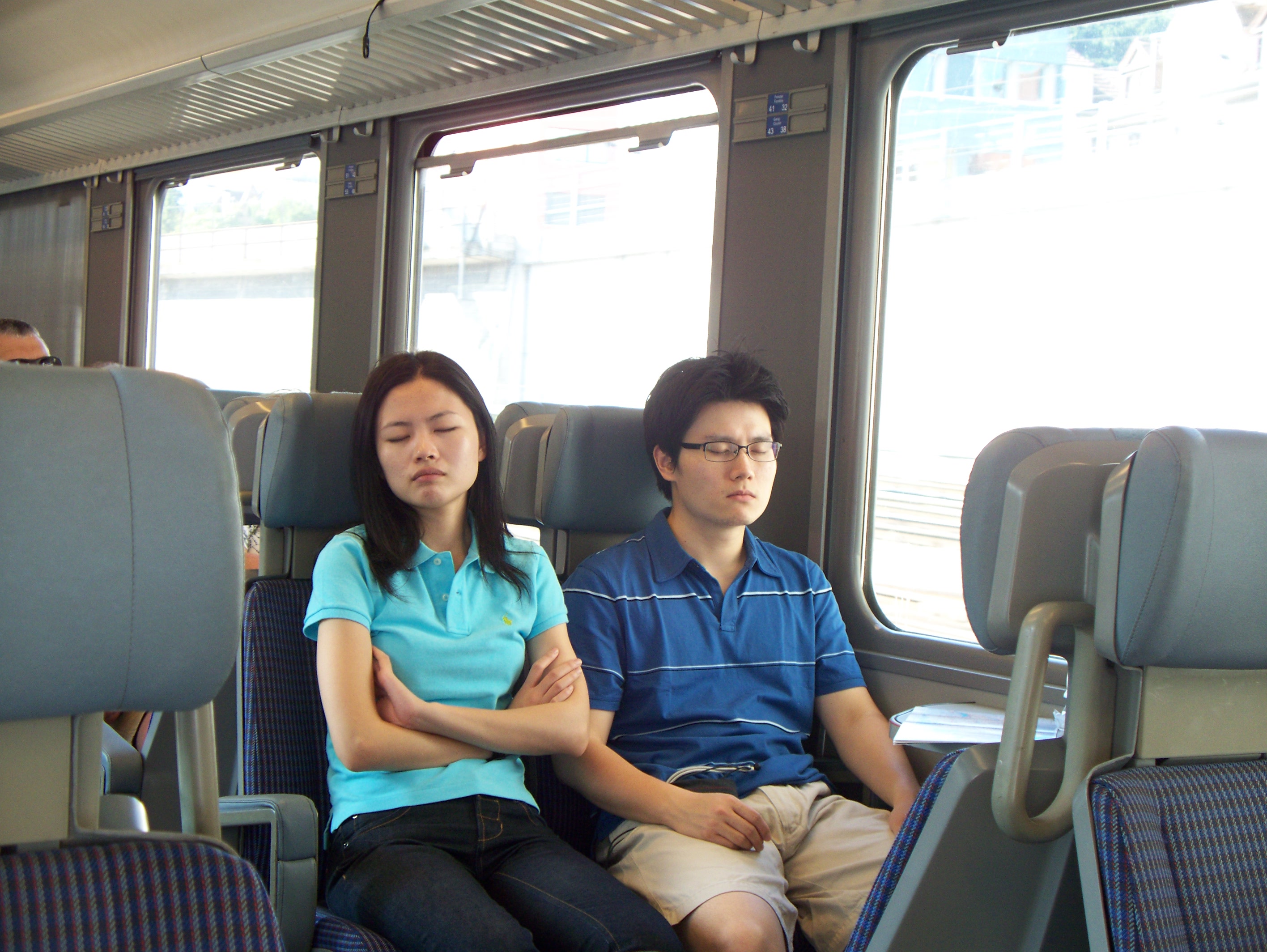 File:Couple Sleeping on a Train.jpg - Wikimedia Commons